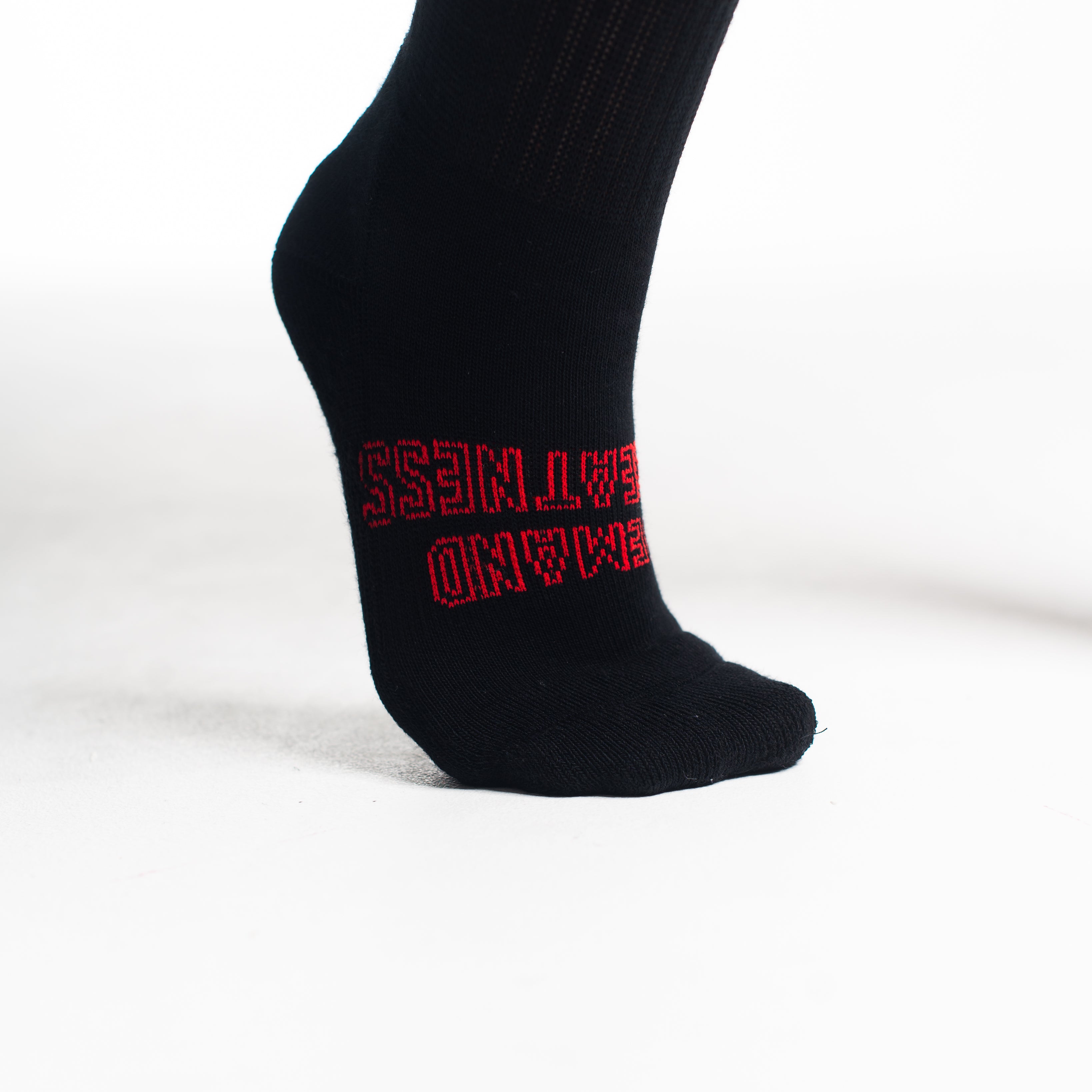 Close-up of knit texture on Red Dawn deadlift socks, emphasizing sturdy fabric and smooth stitching.
