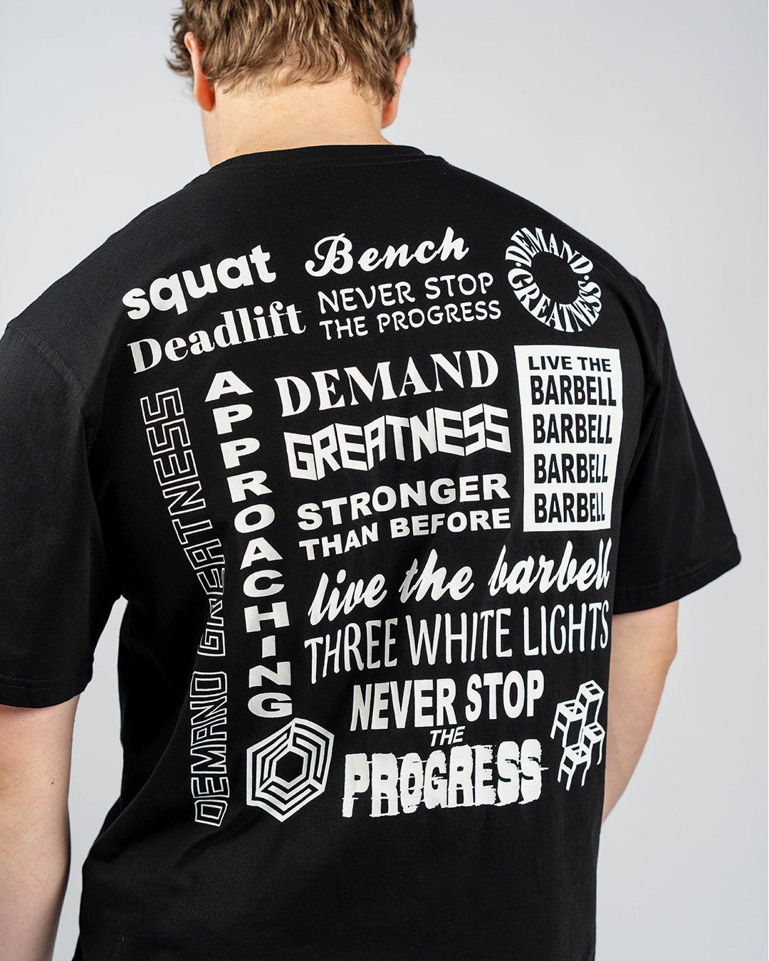 Back view of A7 Affirmation Over-Fit Shirt in Domino colorway showing drop shoulder and relaxed silhouette.