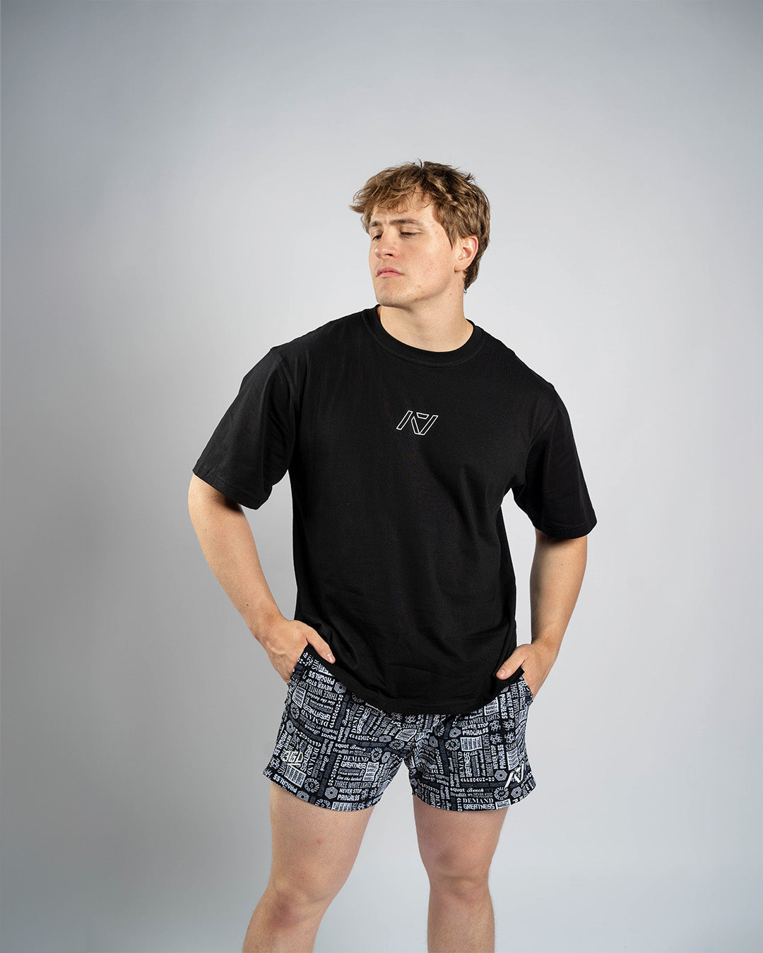 Front view of Affirmation Over-Fit Shirt – Domino featuring oversized unisex fit and white A7 logo print on black fabric.