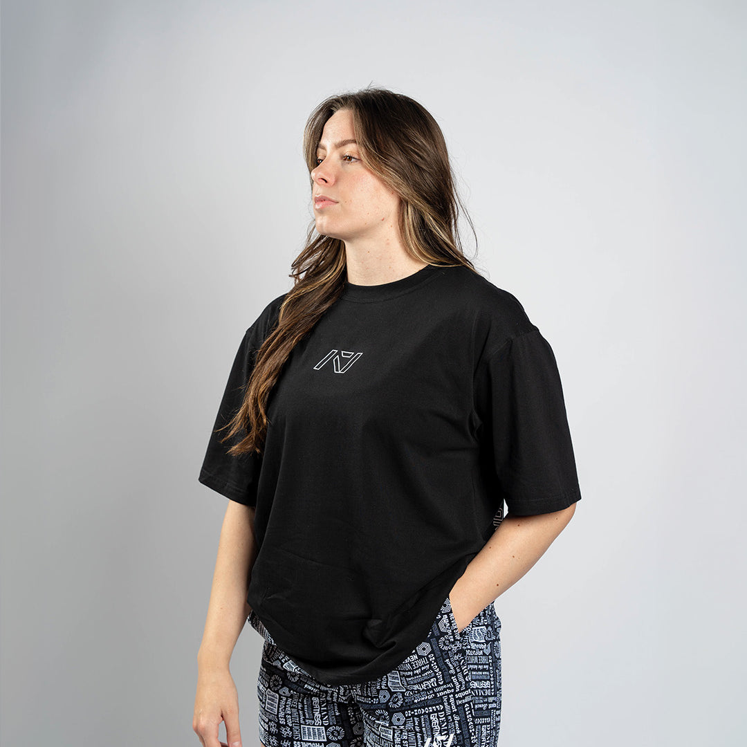 Front view of Affirmation Over-Fit Shirt – Domino featuring oversized unisex fit and white A7 logo print on black fabric.