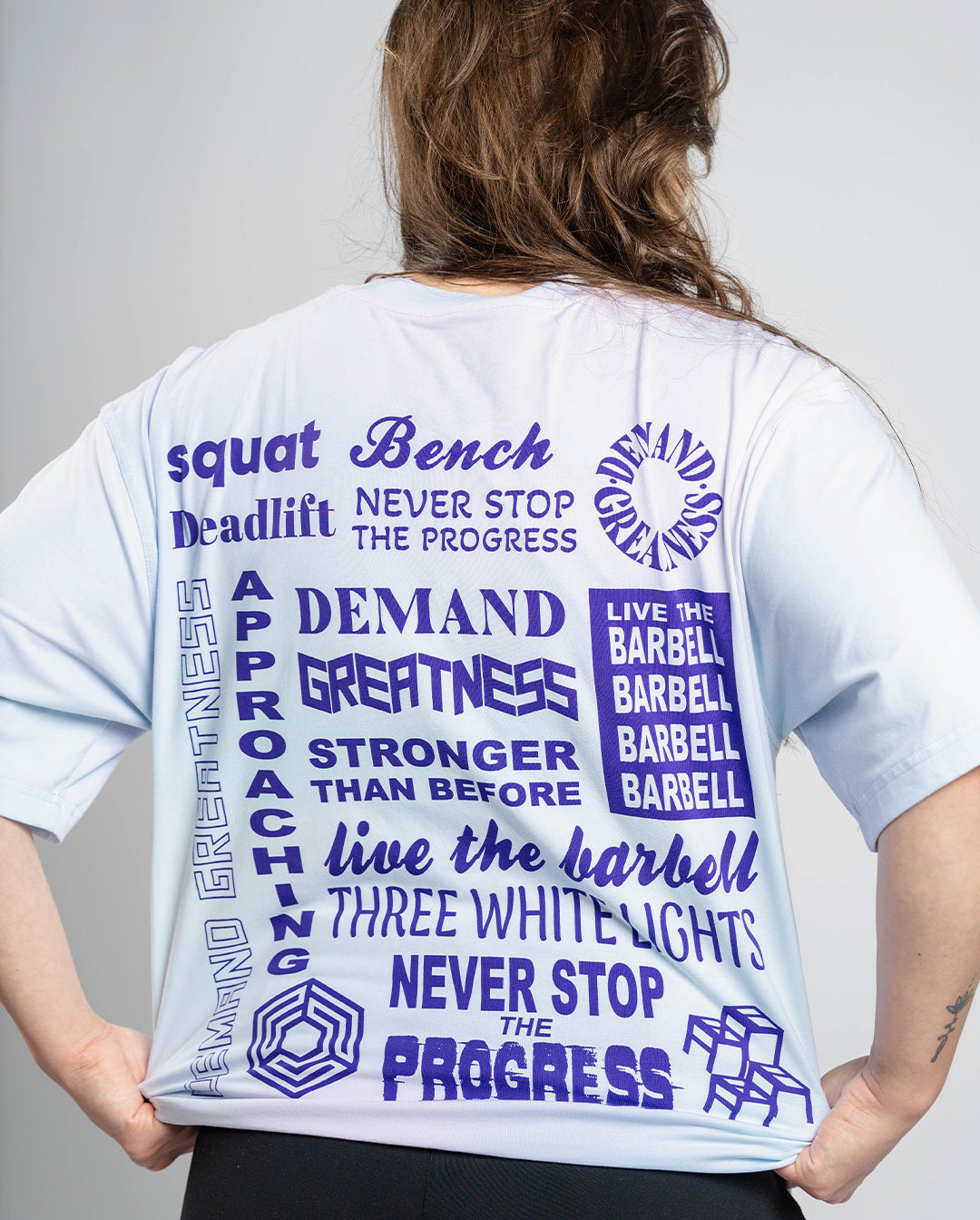 Back view of Affirmation Over-Fit Shirt – Pastel showing loose drop-shoulder fit and clean, minimal style.