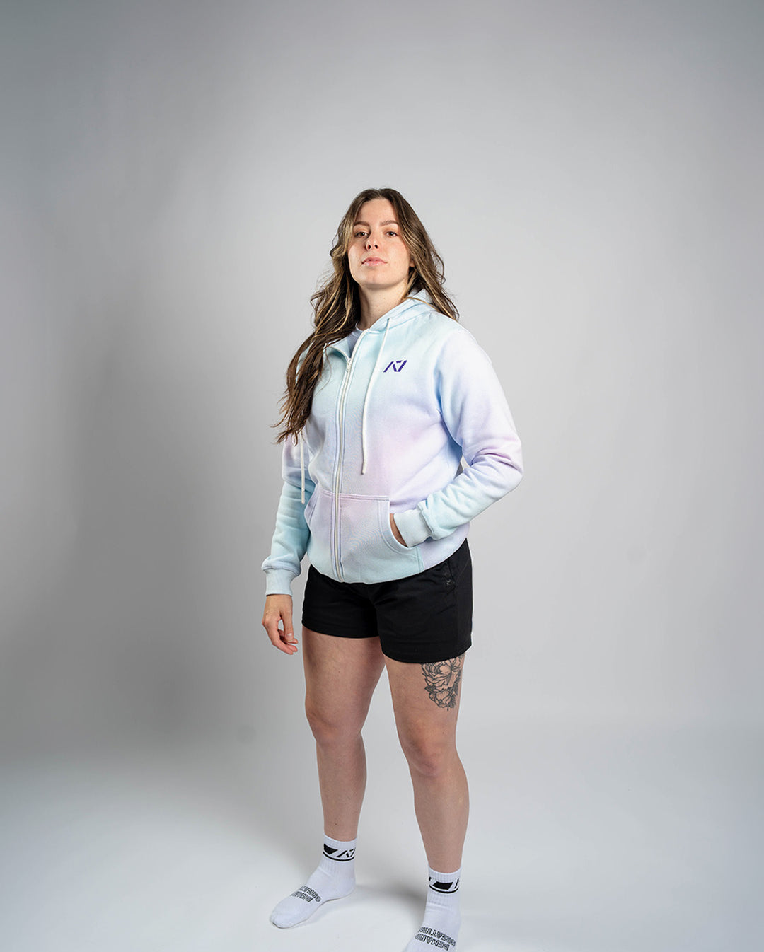 Athlete wearing the A7 Affirmation Zip Hoodie – Pastel demonstrating fit and style in a gym setting.