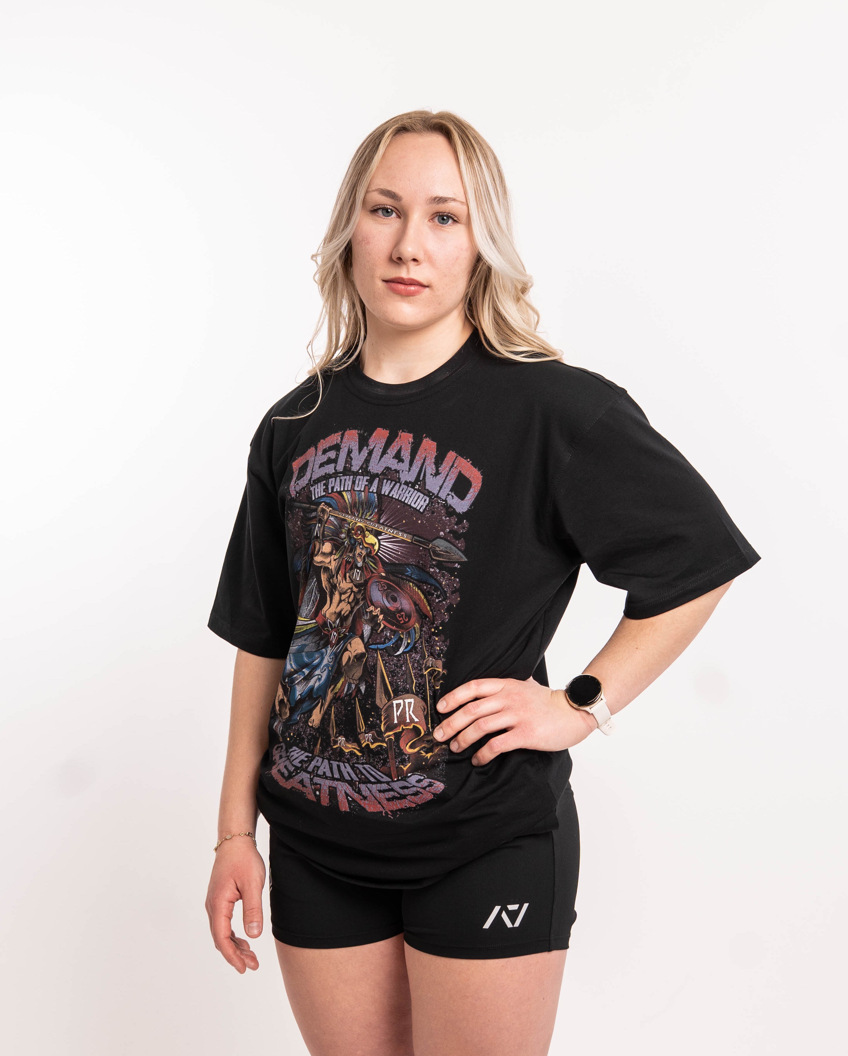 Side profile of Aztec Warrior Over-Fit Unisex Shirt demonstrating the relaxed fit and sleeve length.