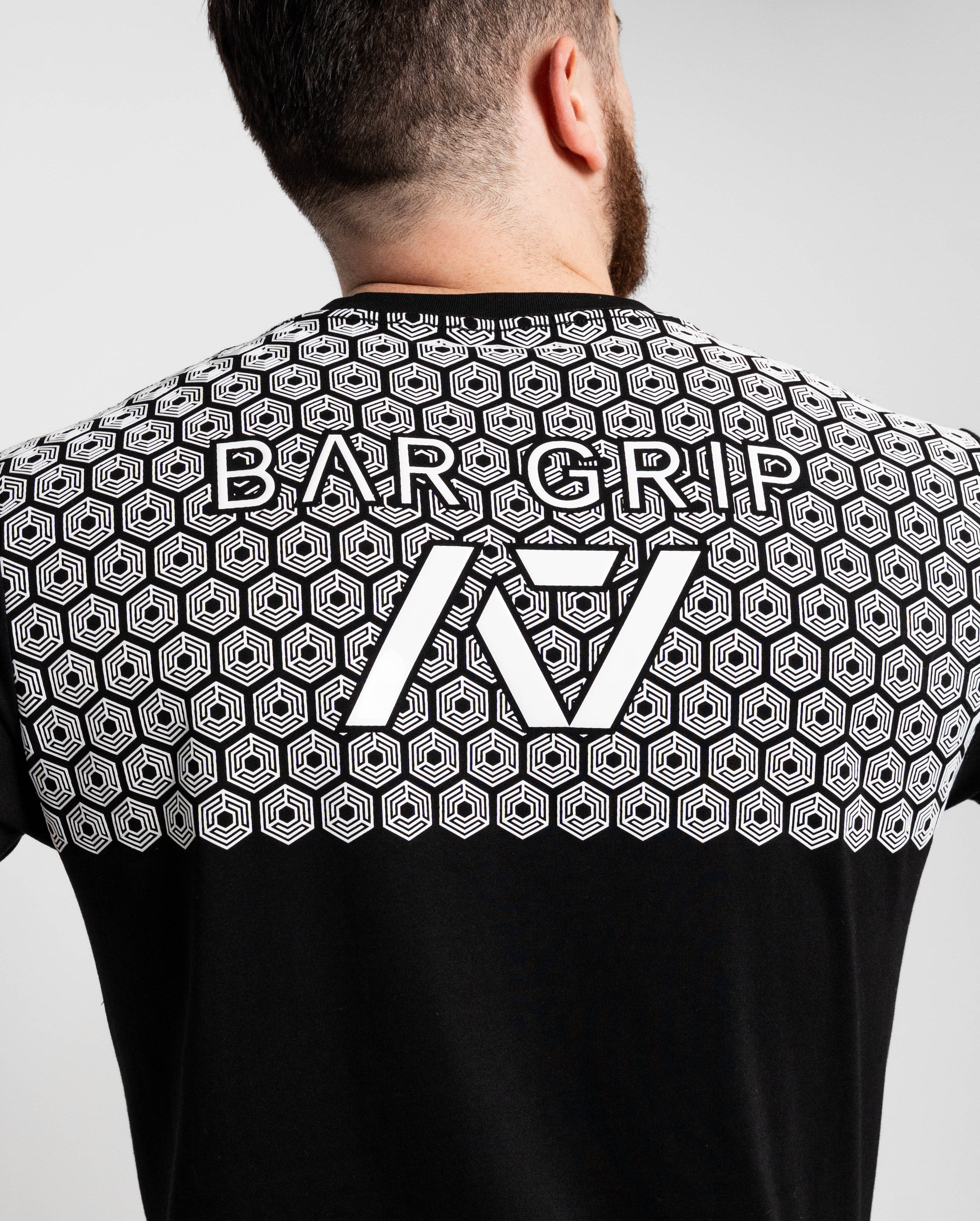 Close up of bar grip on barbell dna mens bar grip shirt