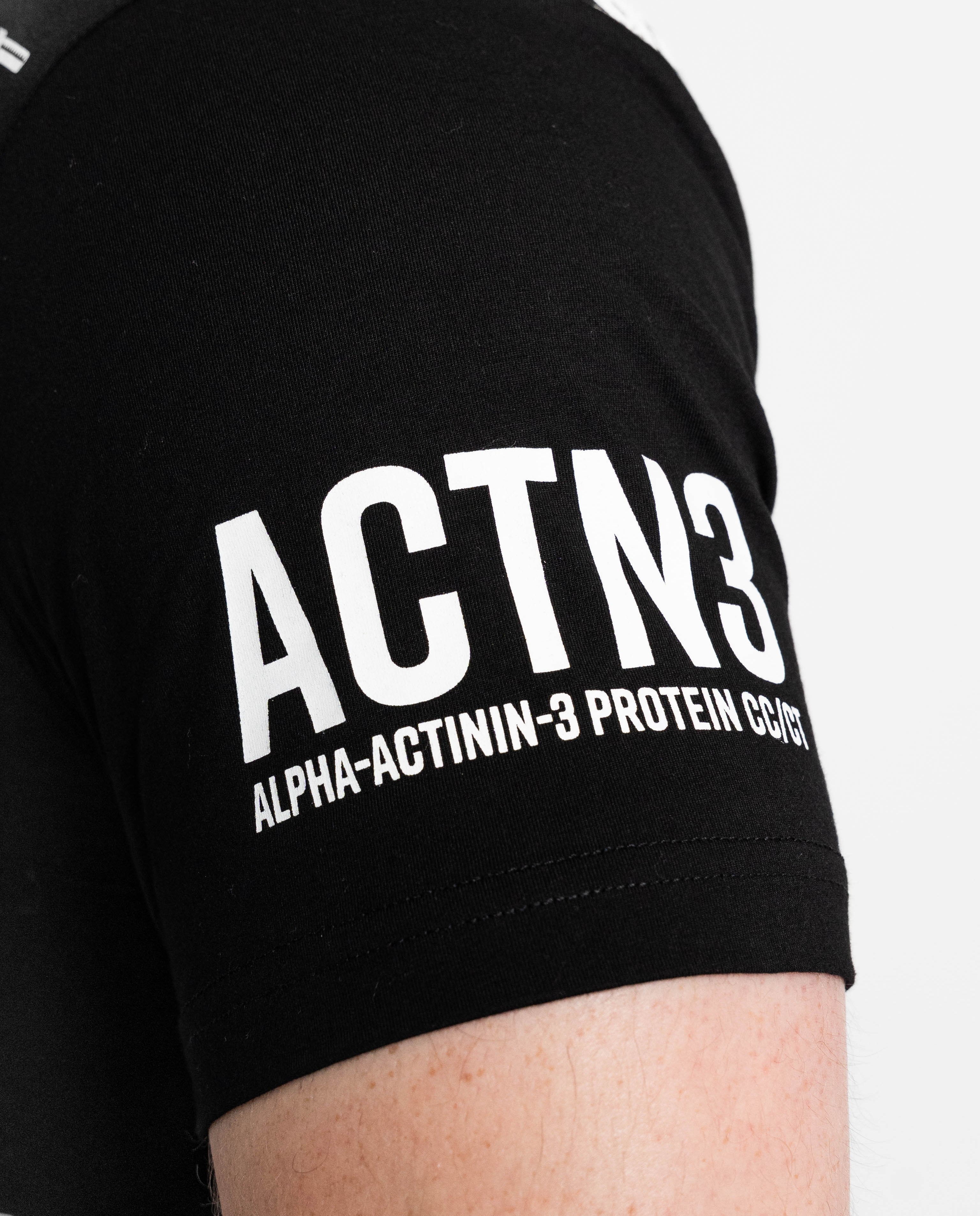 Close up of sleeve on barbell dna mens bar grip shirt