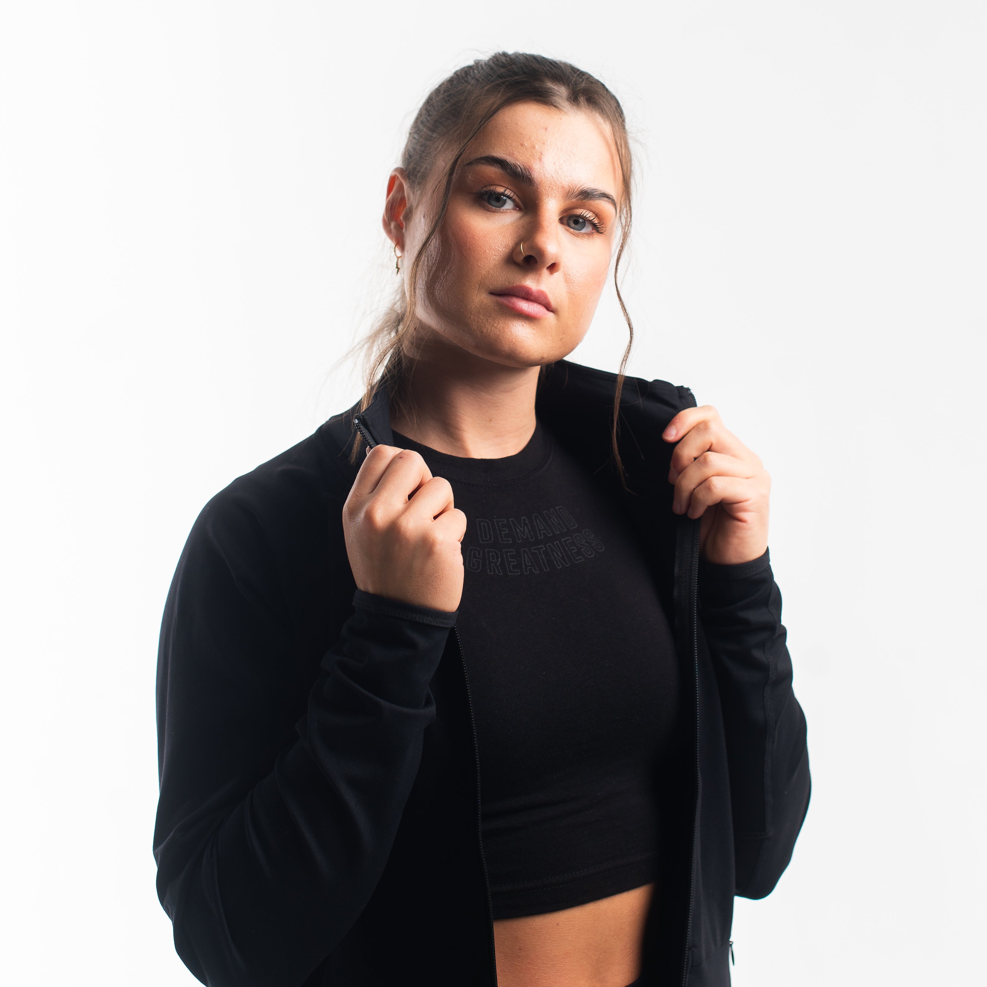 Front view of the A7 Defy Jacket – Stealth, showing clean unisex fit and front zipper design.