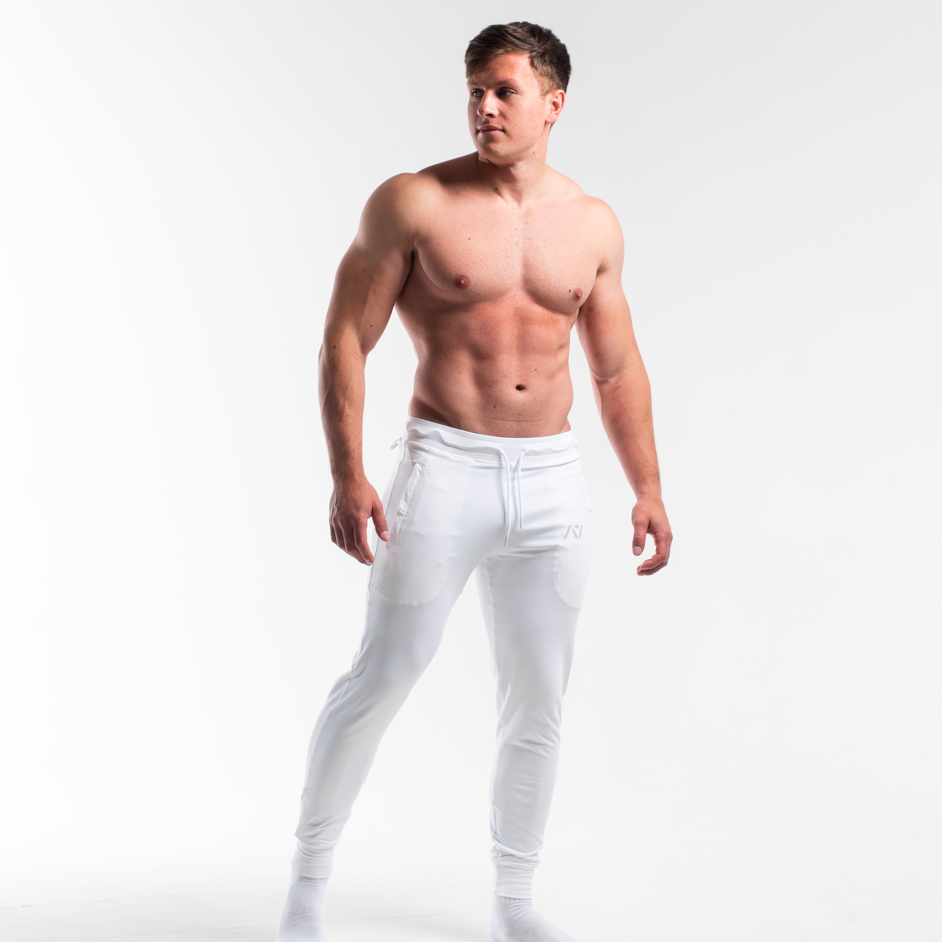 Front view of Polar Defy Joggers showing mid-rise waist, tapered legs, and zippered front pockets.