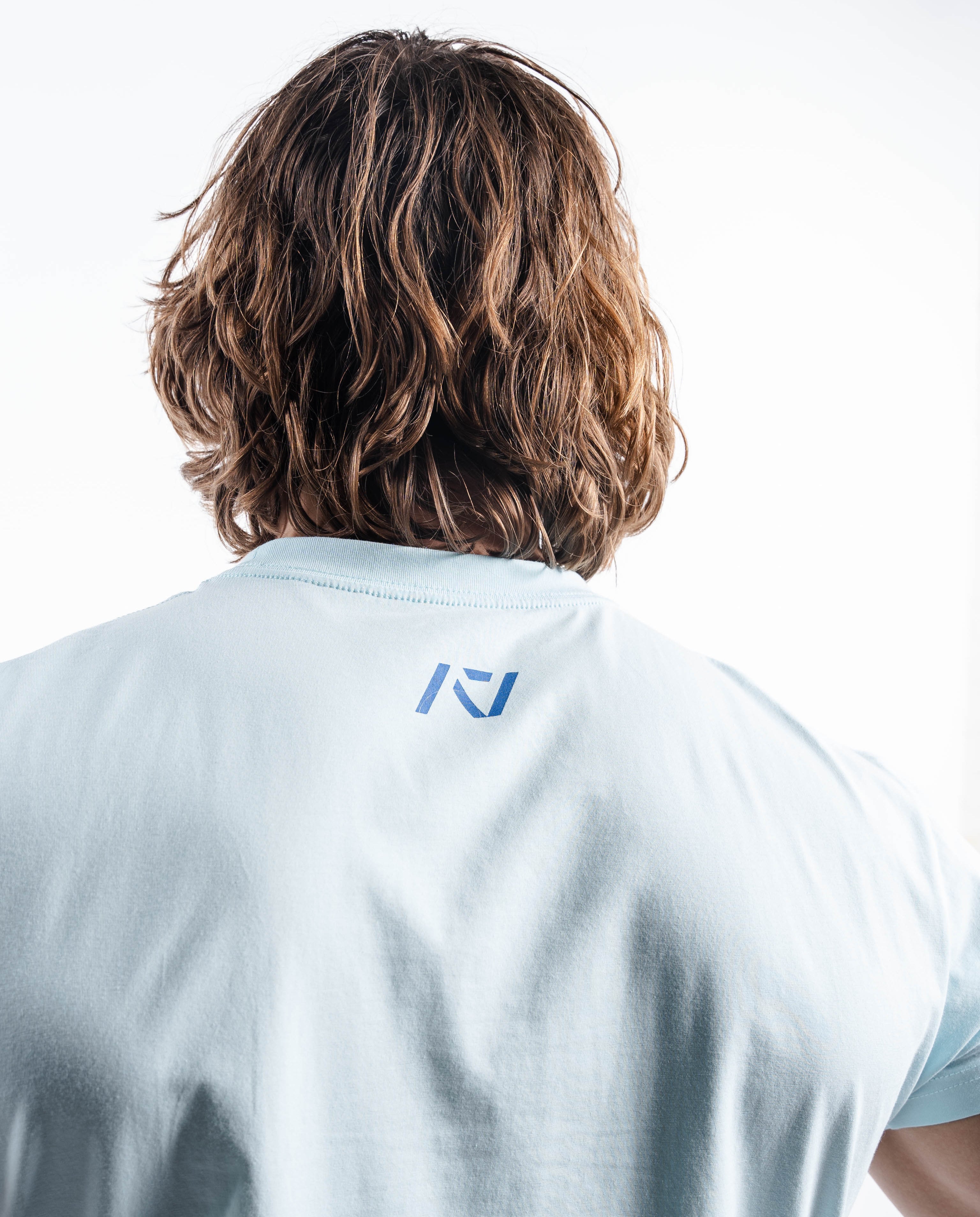 Back view of the Cyanite shirt, highlighting the A7 logo printed just below the neckline.
