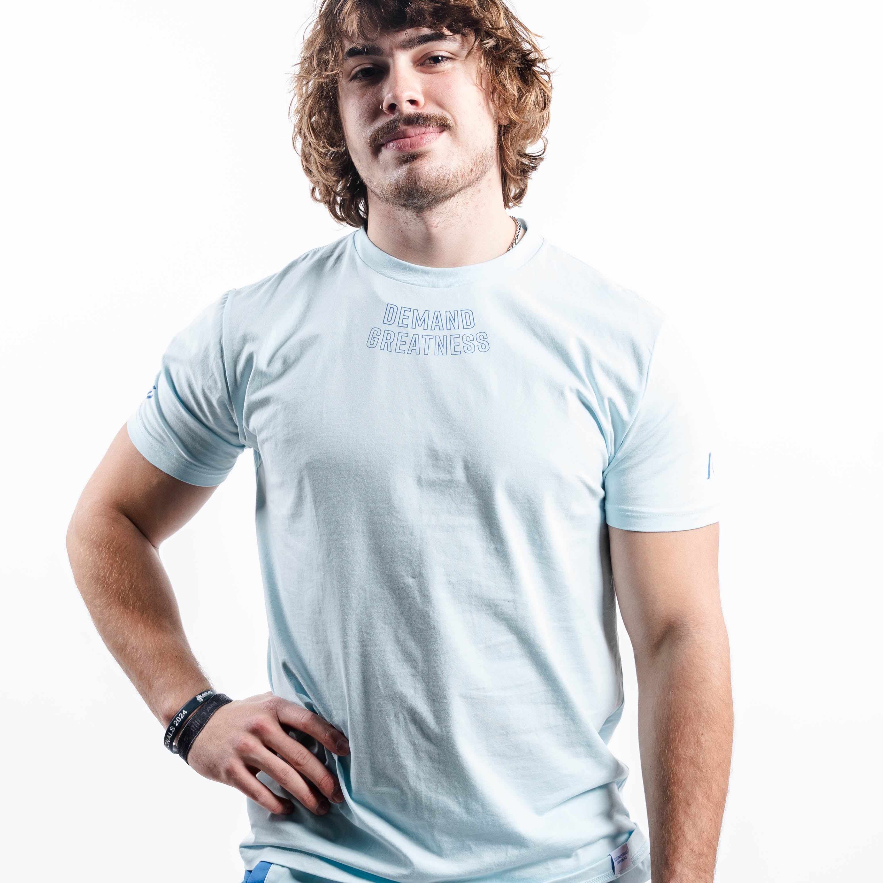 Front view of the Cyanite True‑Fit Meet Shirt showcasing “Demand Greatness” print and clean torso fit.