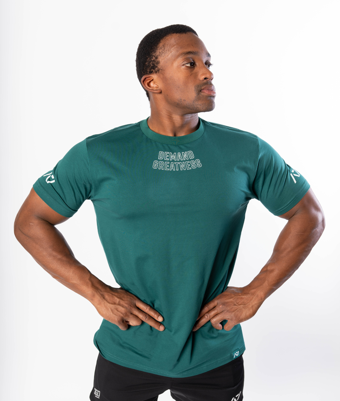 Front view of the Emerald Forás True‑Fit Meet Shirt showing “Demand Greatness” chest print and trimmed fit.