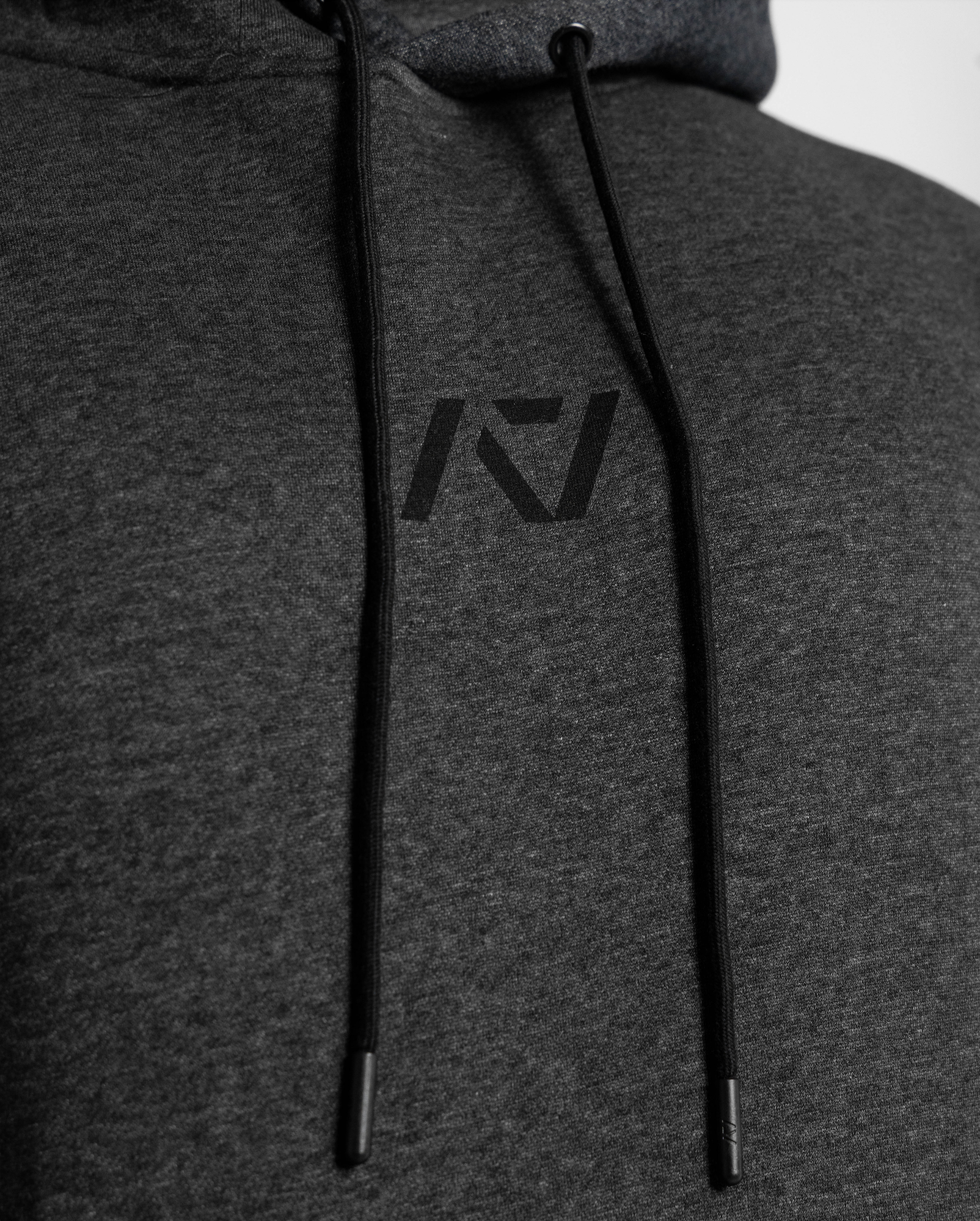 Gray hoodie with a logo on the chest against a white background