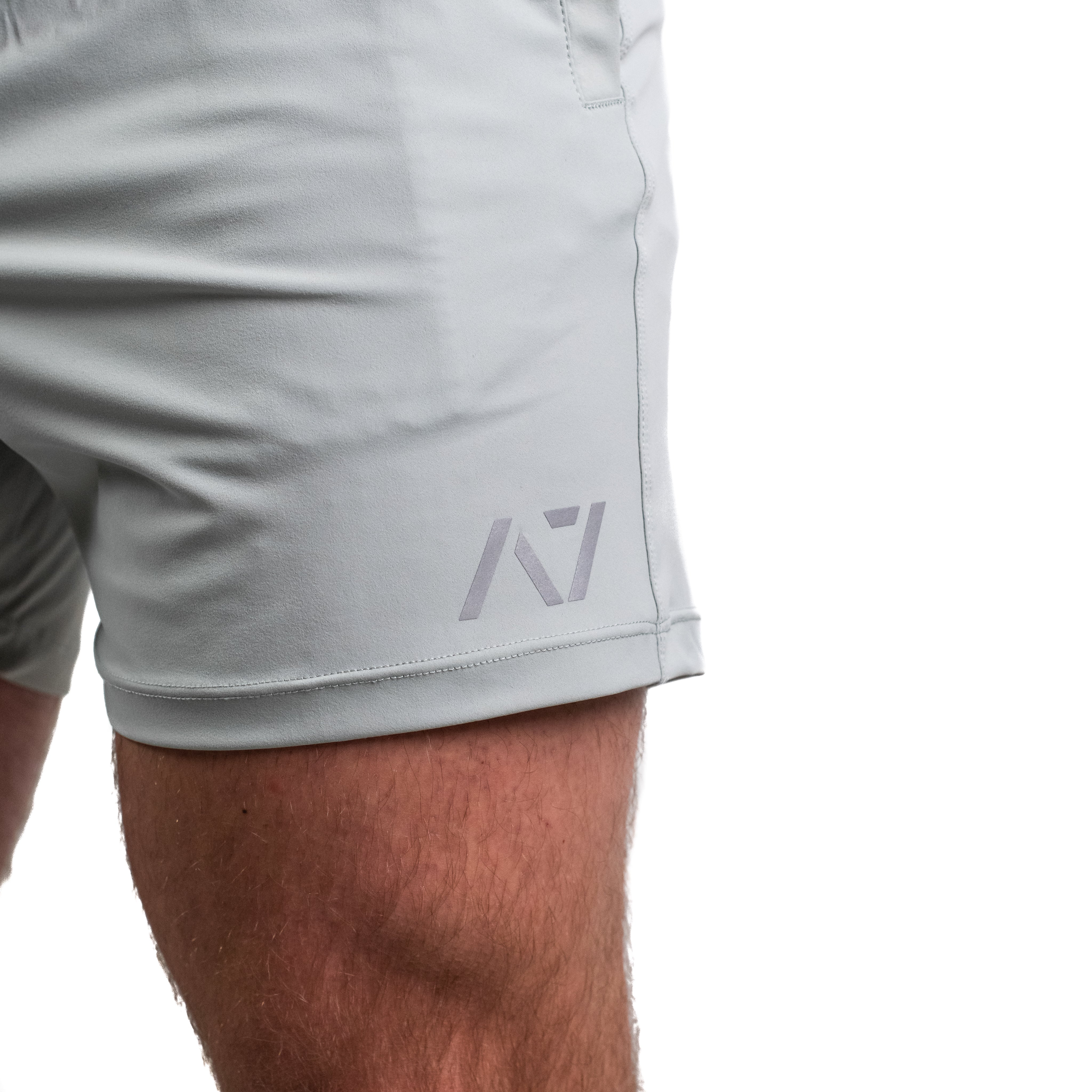 Matte silicone A7 logo on Light Gray 360Go Shorts offering subtle branding and clean aesthetics.
