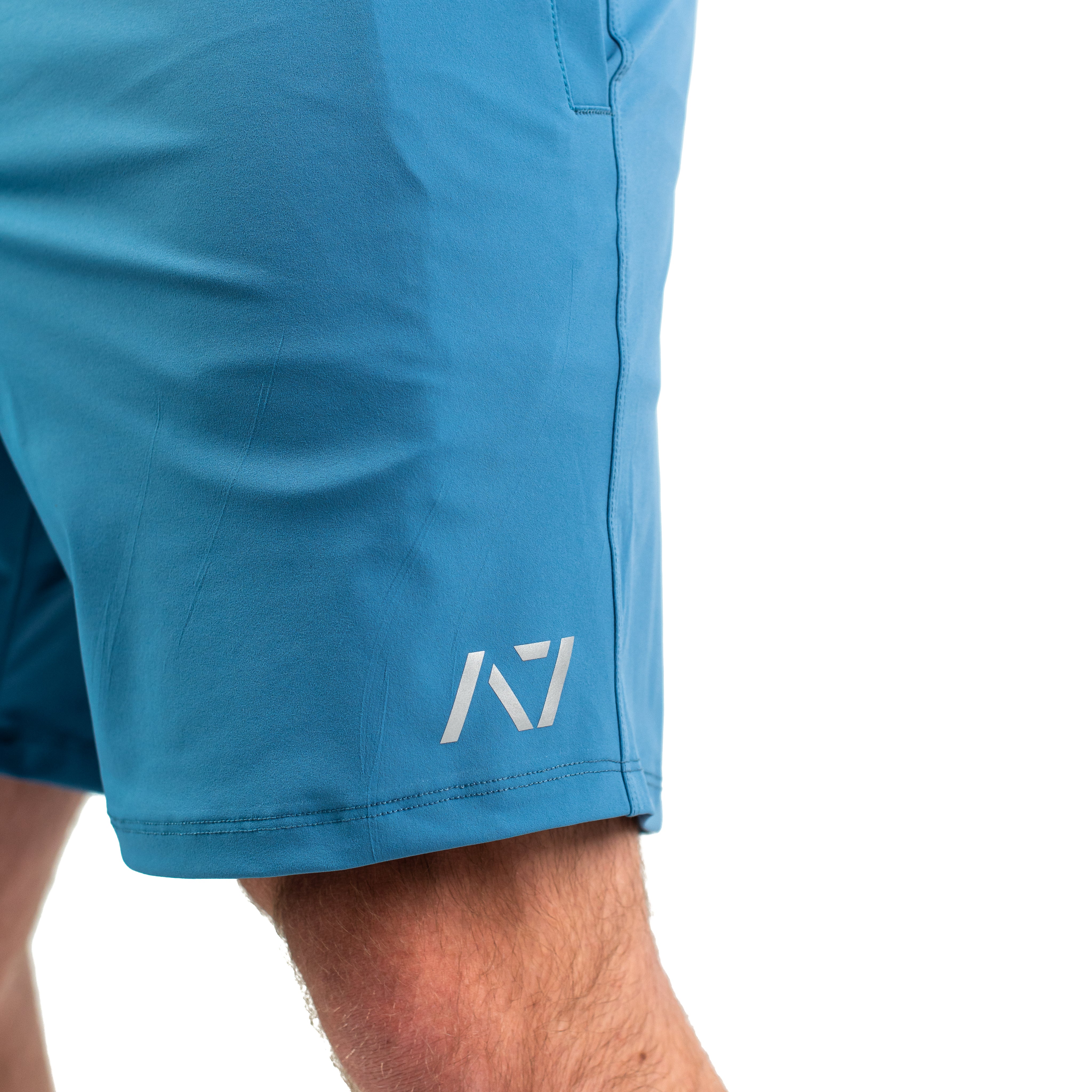 Matte silicone A7 logos on Honor 360Go Shorts in olive green for clean, durable branding.