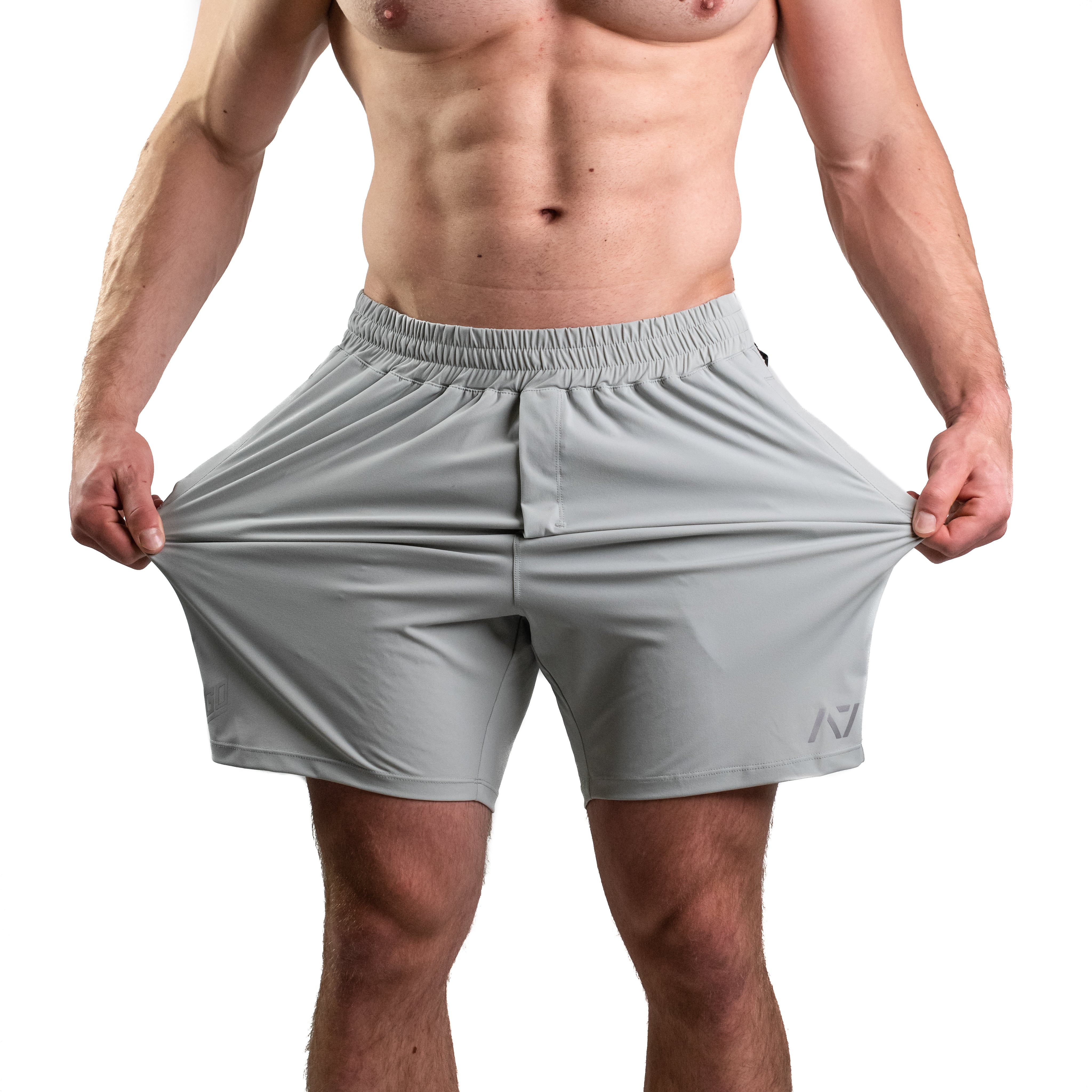 Close-up of 360-degree stretch fabric on Light Gray 360Go Shorts for total mobility during strength training.