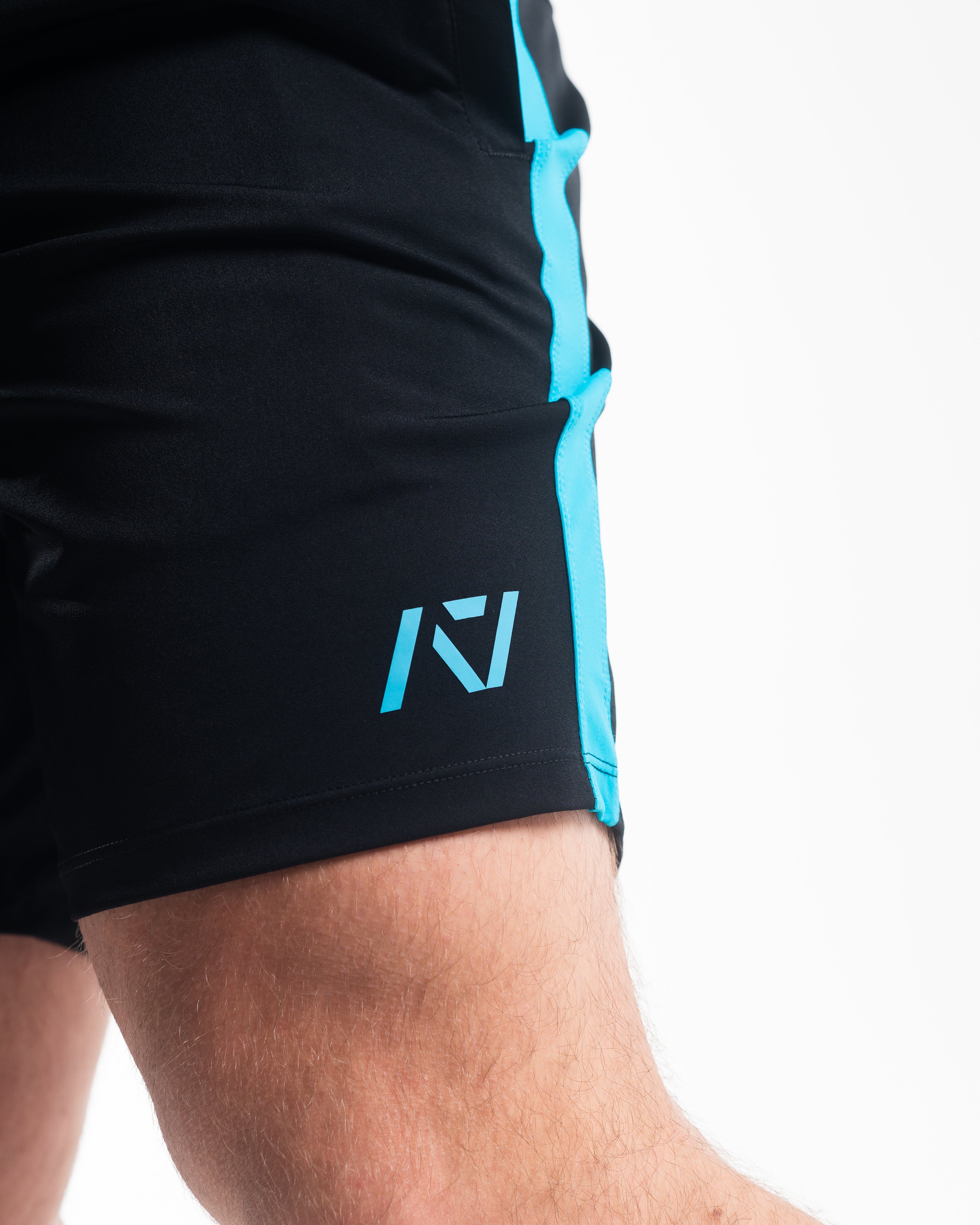 Matte silicone A7 logo on Azul 360Go KWD Shorts for subtle, durable branding.
