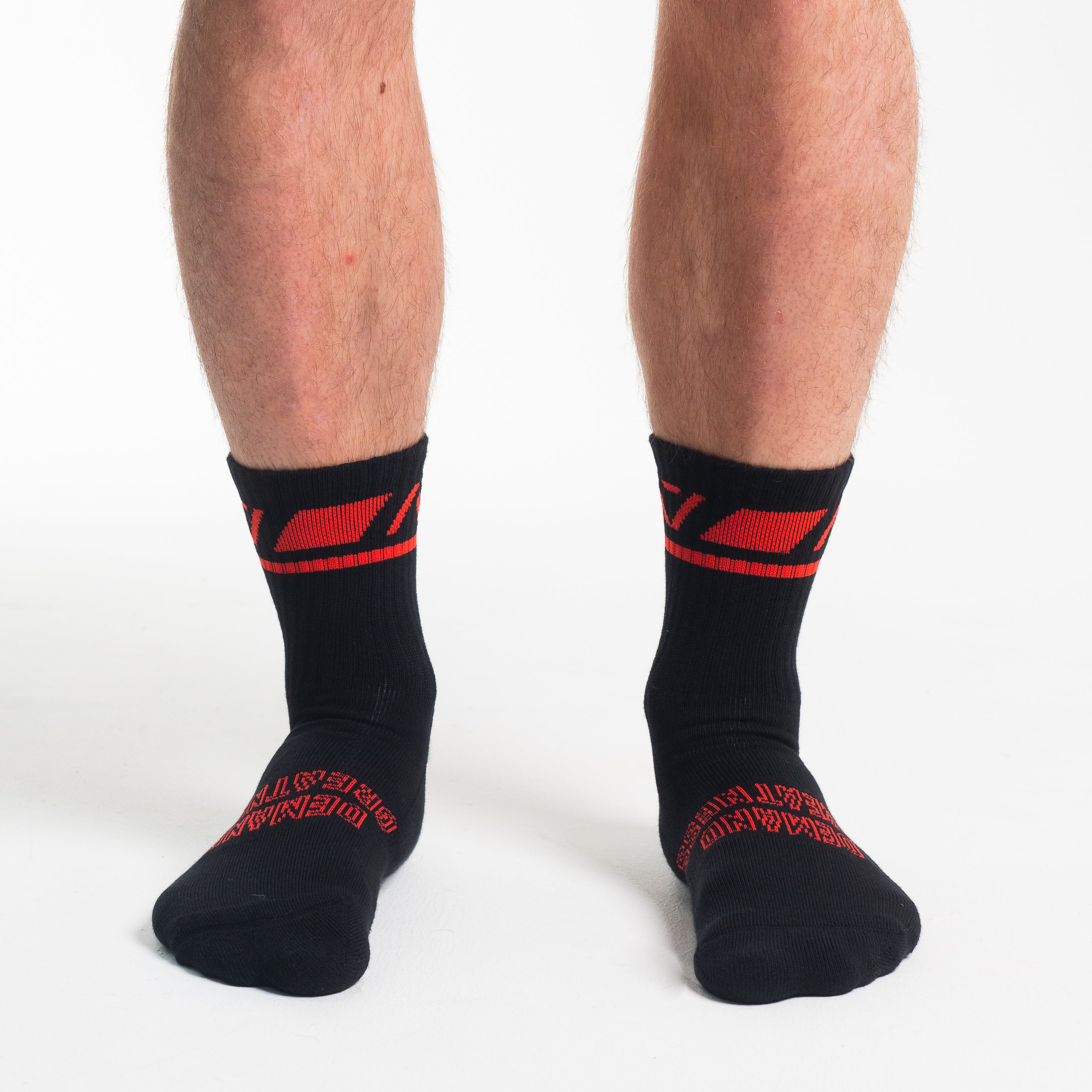Front view of A7 Crew Socks in Red Dawn, showcasing mid-shin length and ribbed cuff design.
