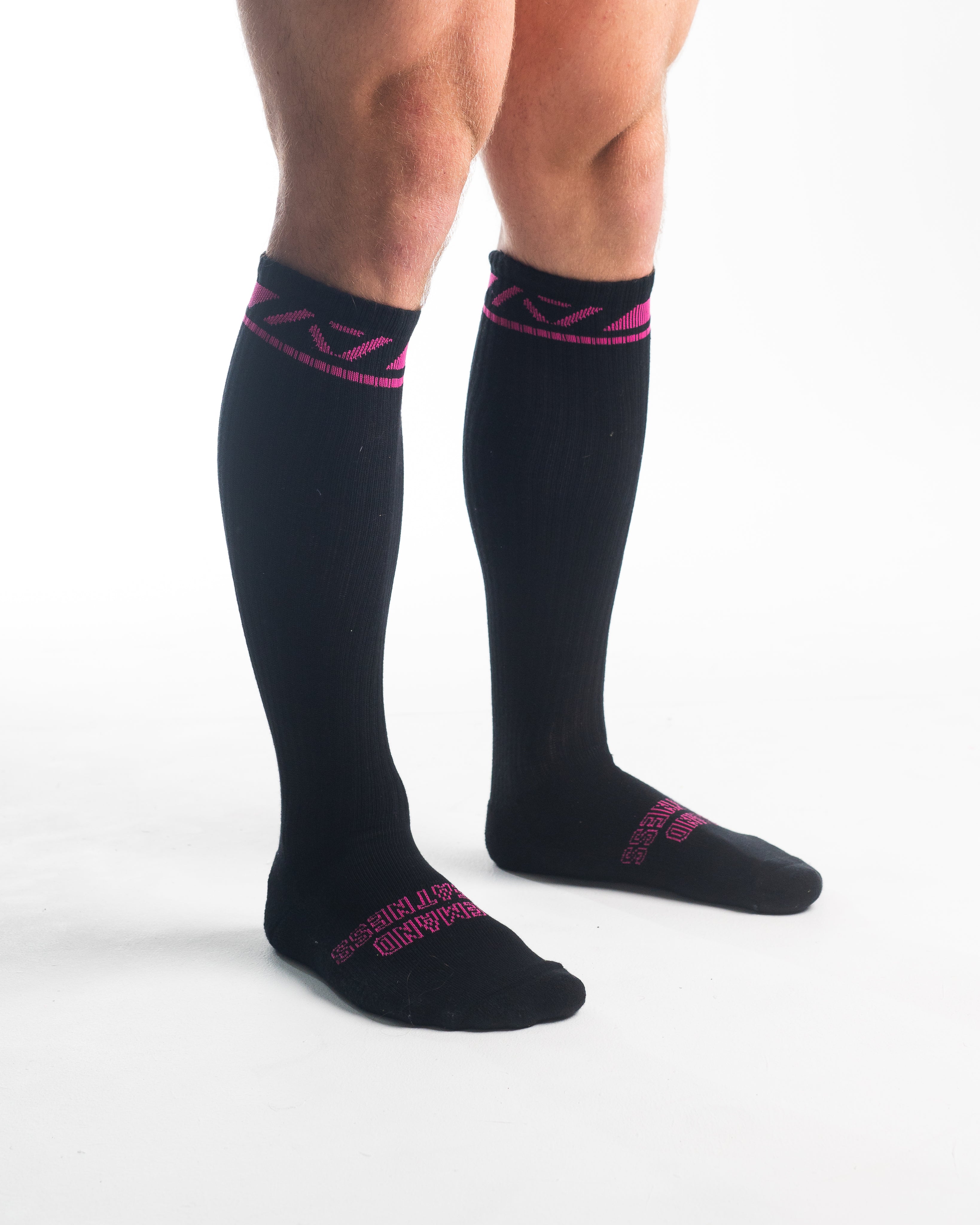 Side profile of A7 Deadlift Socks in Flamingo, highlighting the A7 logo on the ankle and compression-style top.