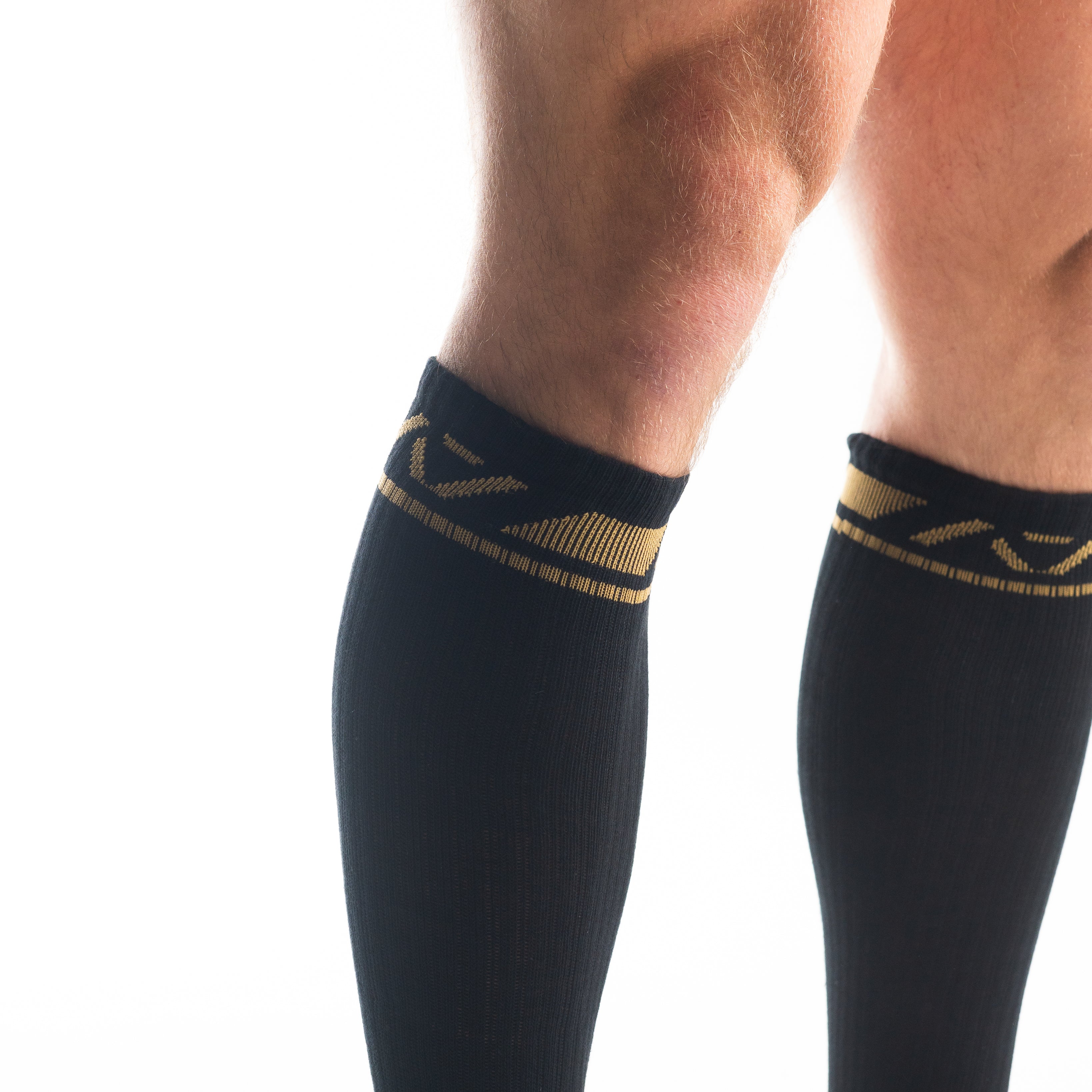 Close-up of the knit fabric on A7 Deadlift Socks in Gold Standard, showing texture and stitching details.