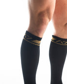 Close-up of the knit fabric on A7 Deadlift Socks in Gold Standard, showing texture and stitching details.