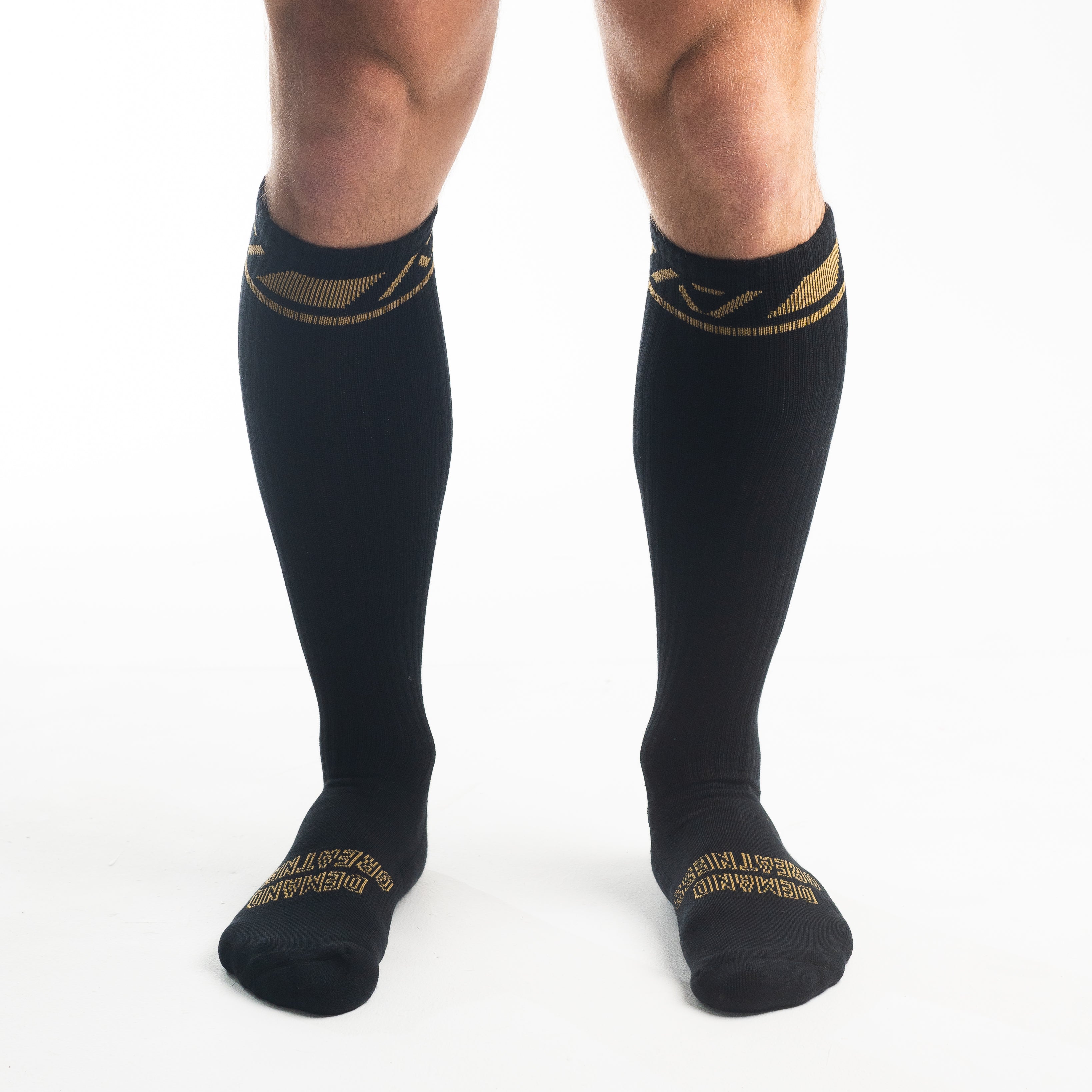 Front view of A7 Deadlift Socks in Gold Standard, showcasing knee-high length and ribbed cuff design.