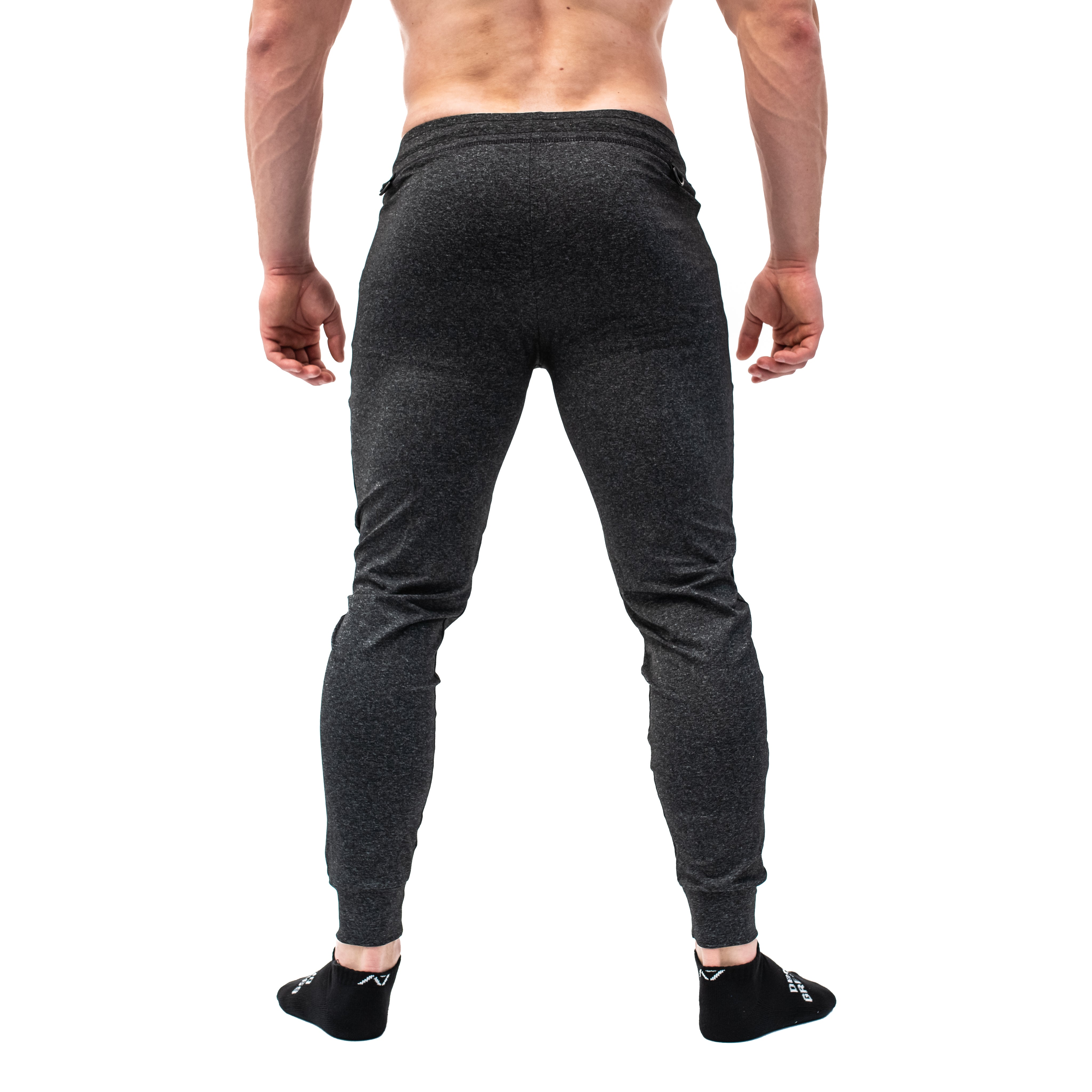 Rear view of Charcoal Defy Joggers highlighting the clean back line and tapered silhouette.