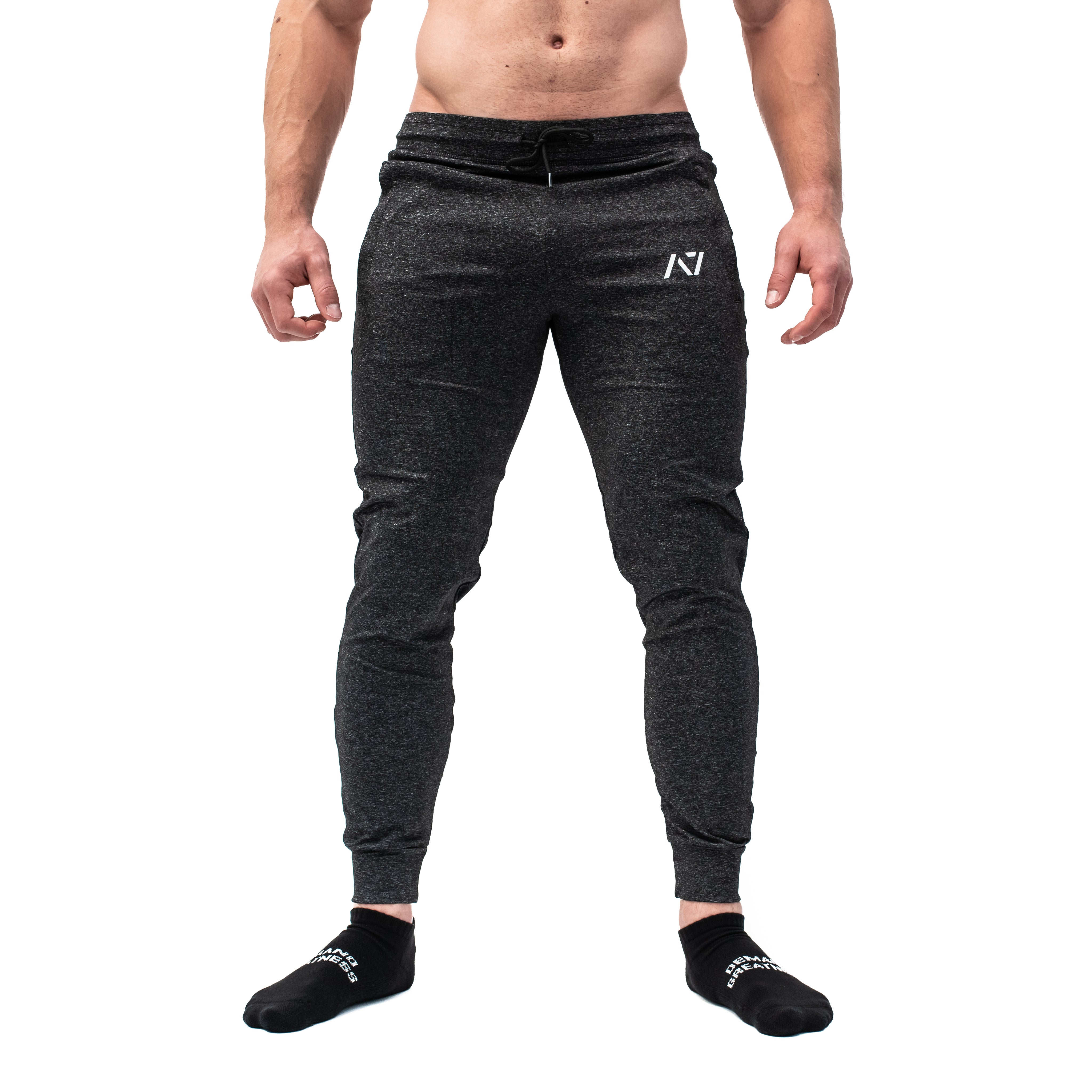 Front view of Charcoal Defy Joggers with a tapered leg, mid-rise waistband, and zipper pocket detailing.