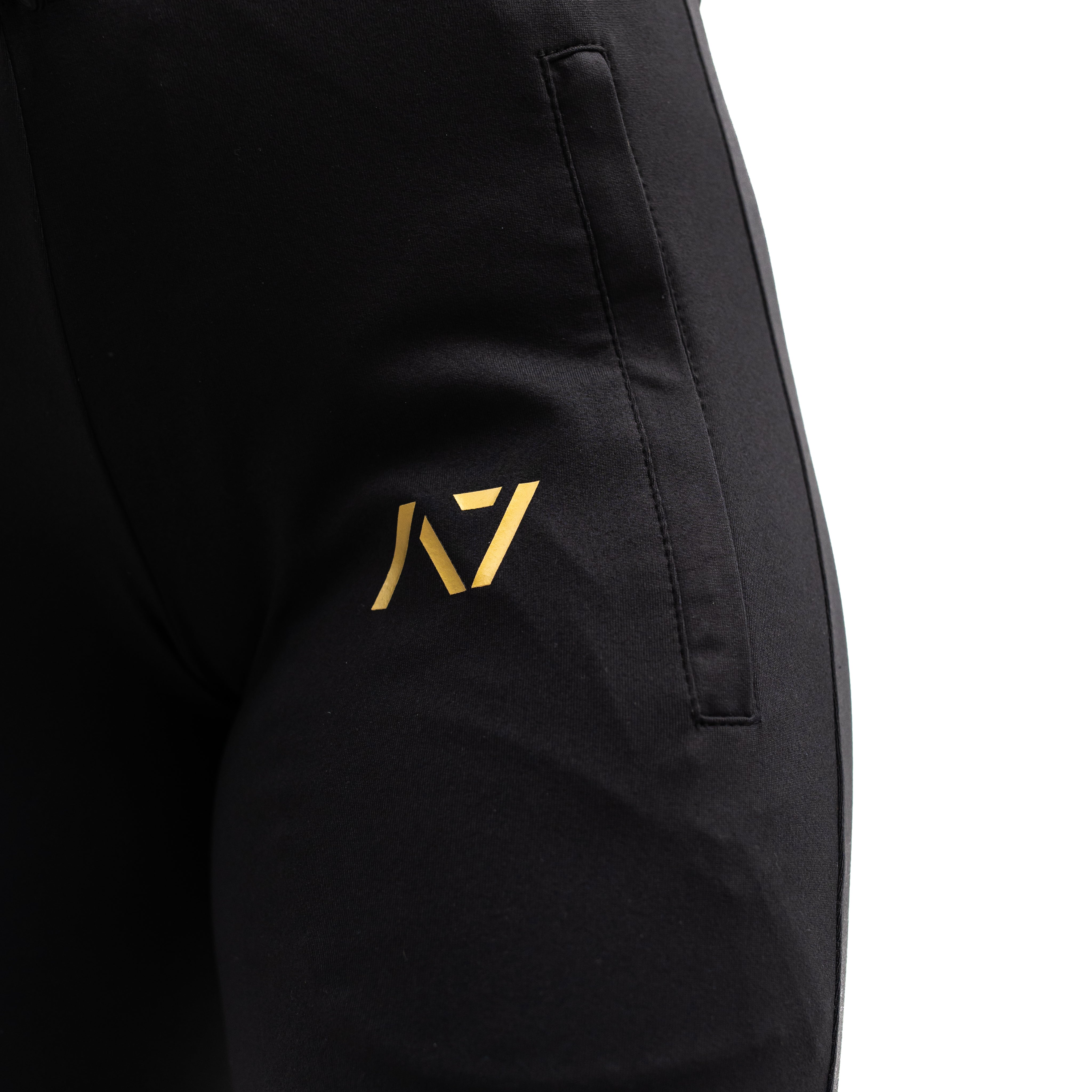 Close-up of gold silicone A7 logo printed on thigh for subtle branding.