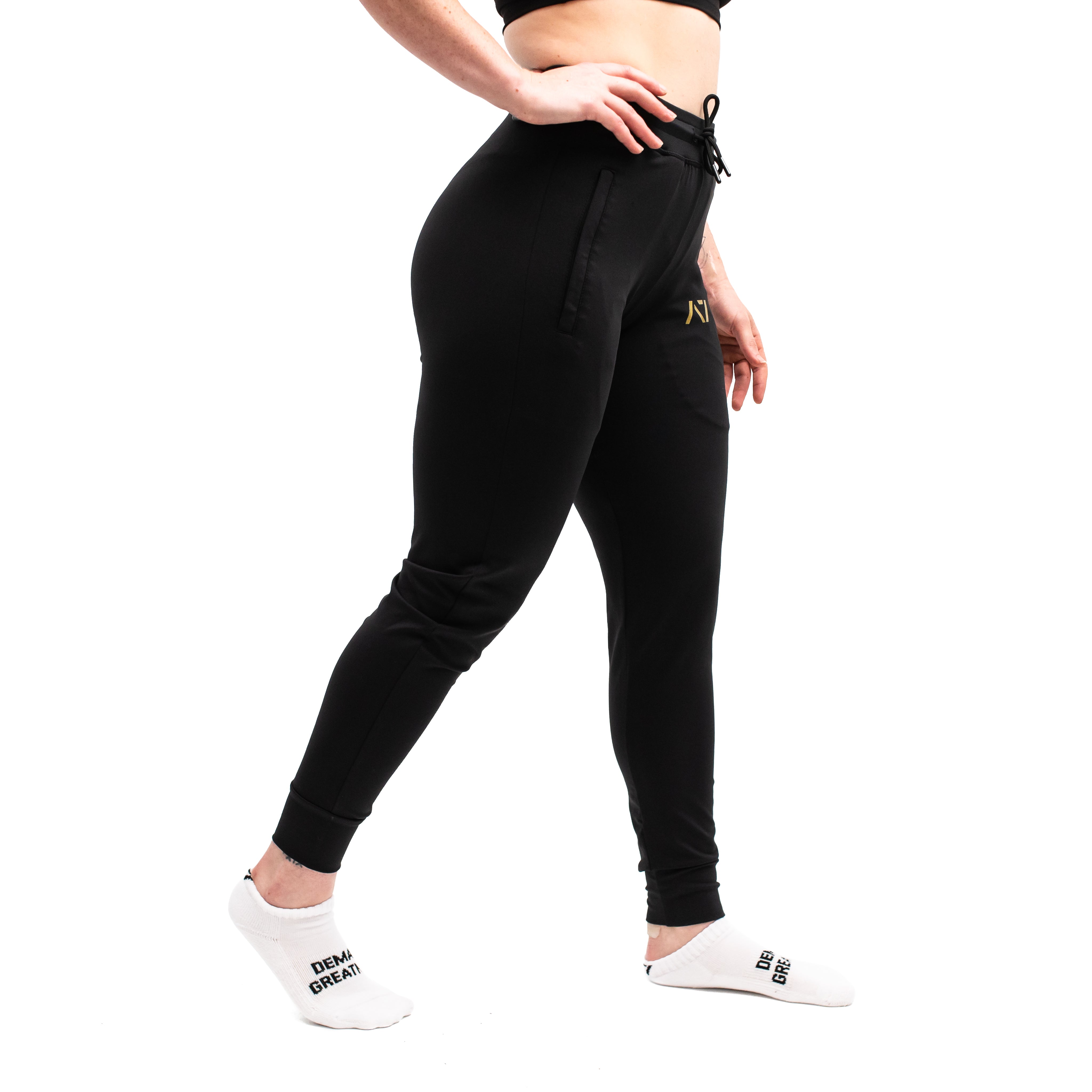 Side profile showing elastic cuff, key clip, and smooth stretch fit of the joggers.