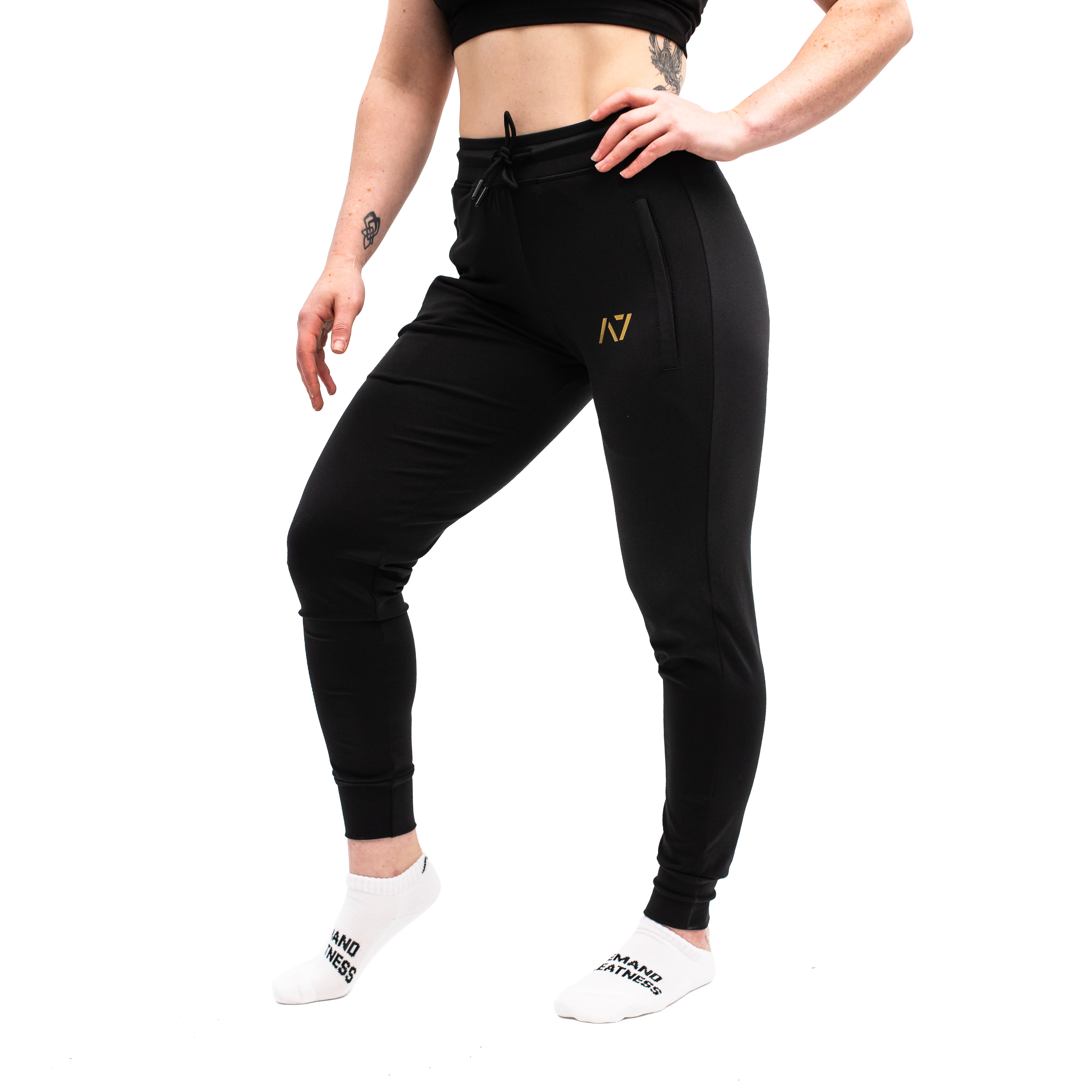 Side profile showing elastic cuff, key clip, and smooth stretch fit of the joggers.