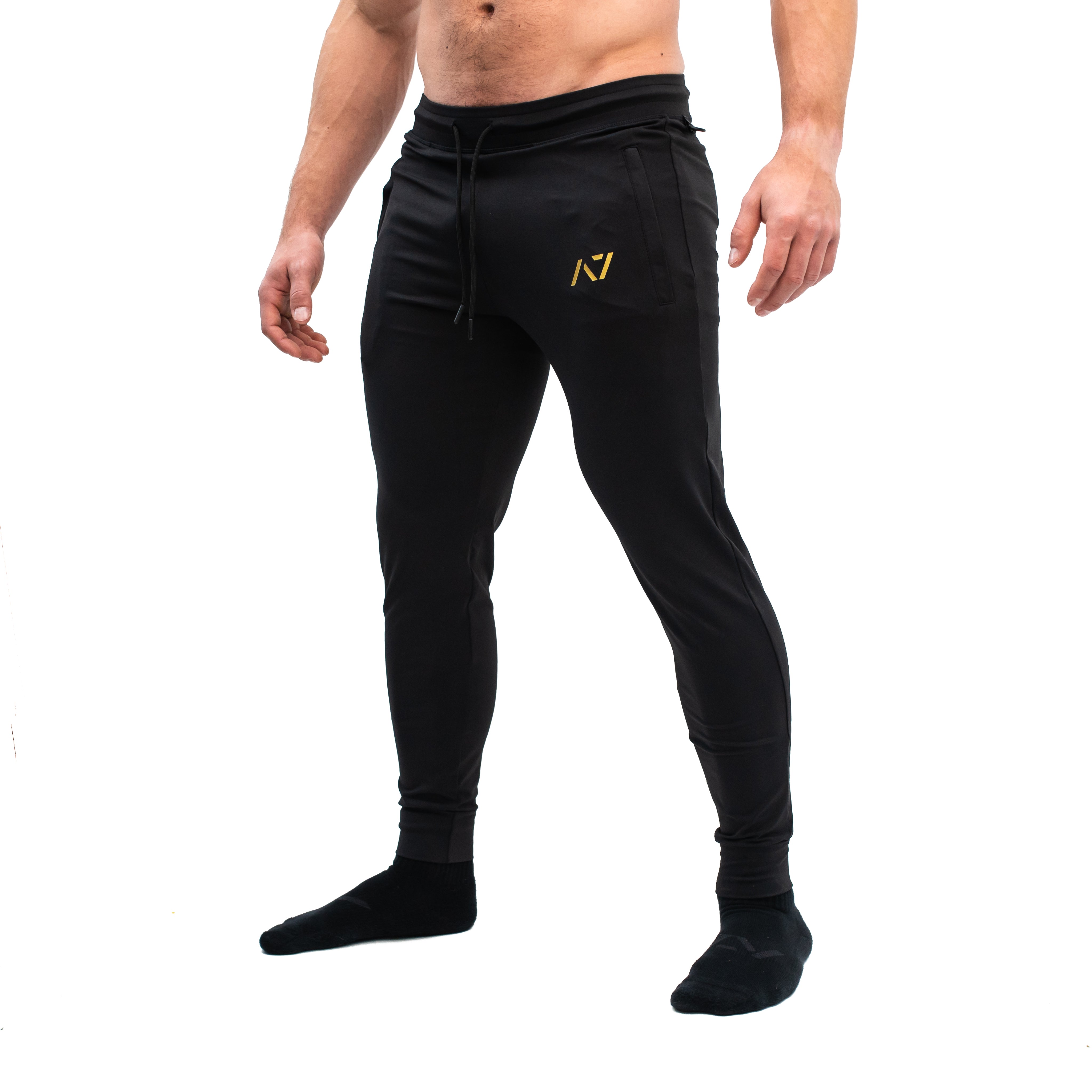 Side profile showing elastic cuff, key clip, and smooth stretch fit of the joggers.