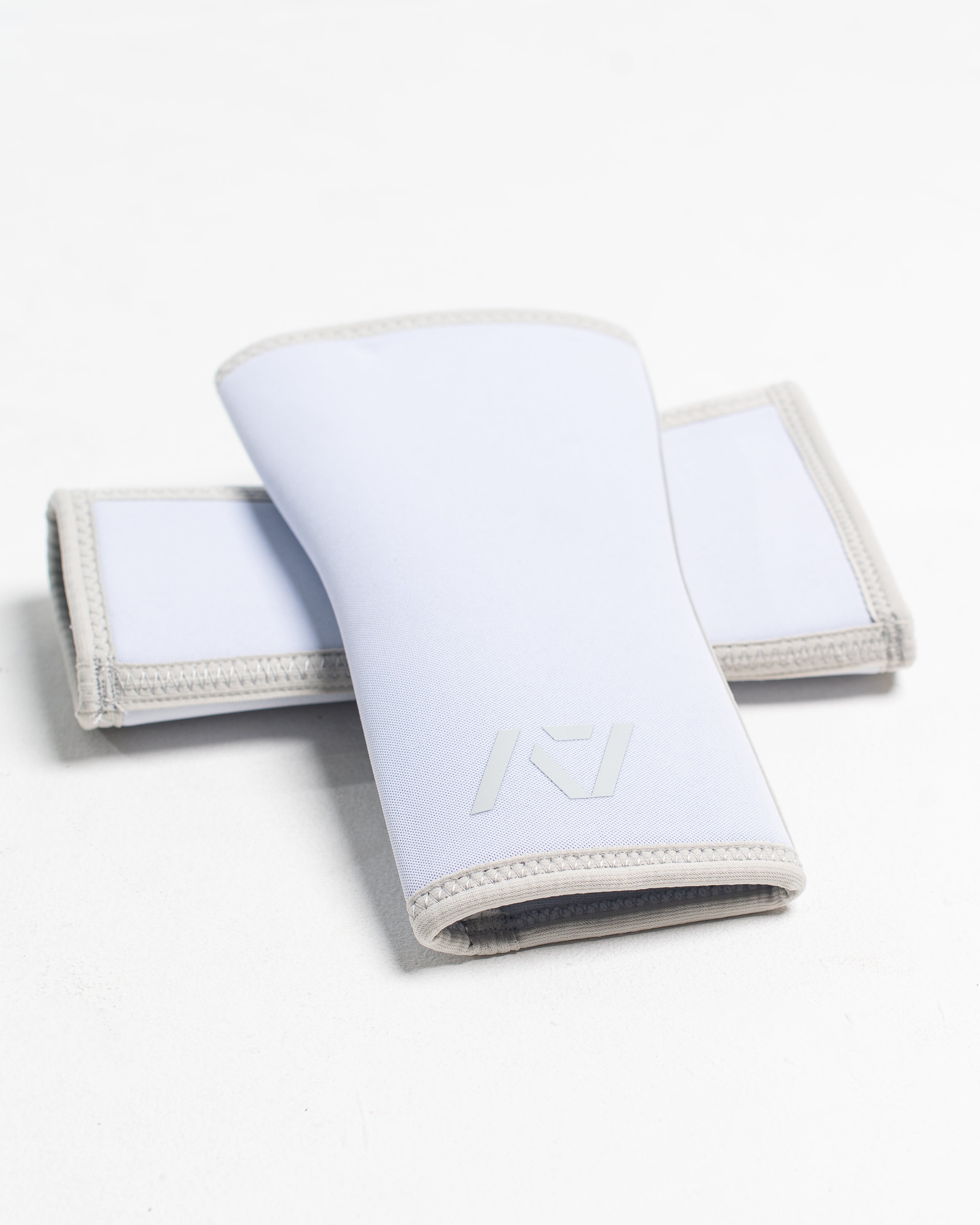 White Knee Sleeves with logo on a white background