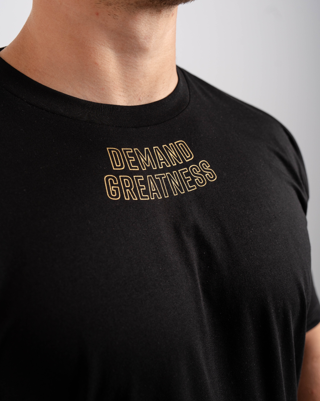 
                  
                    Demand Greatness True-Fit Men's Meet Shirt - Gold Standard
                  
                