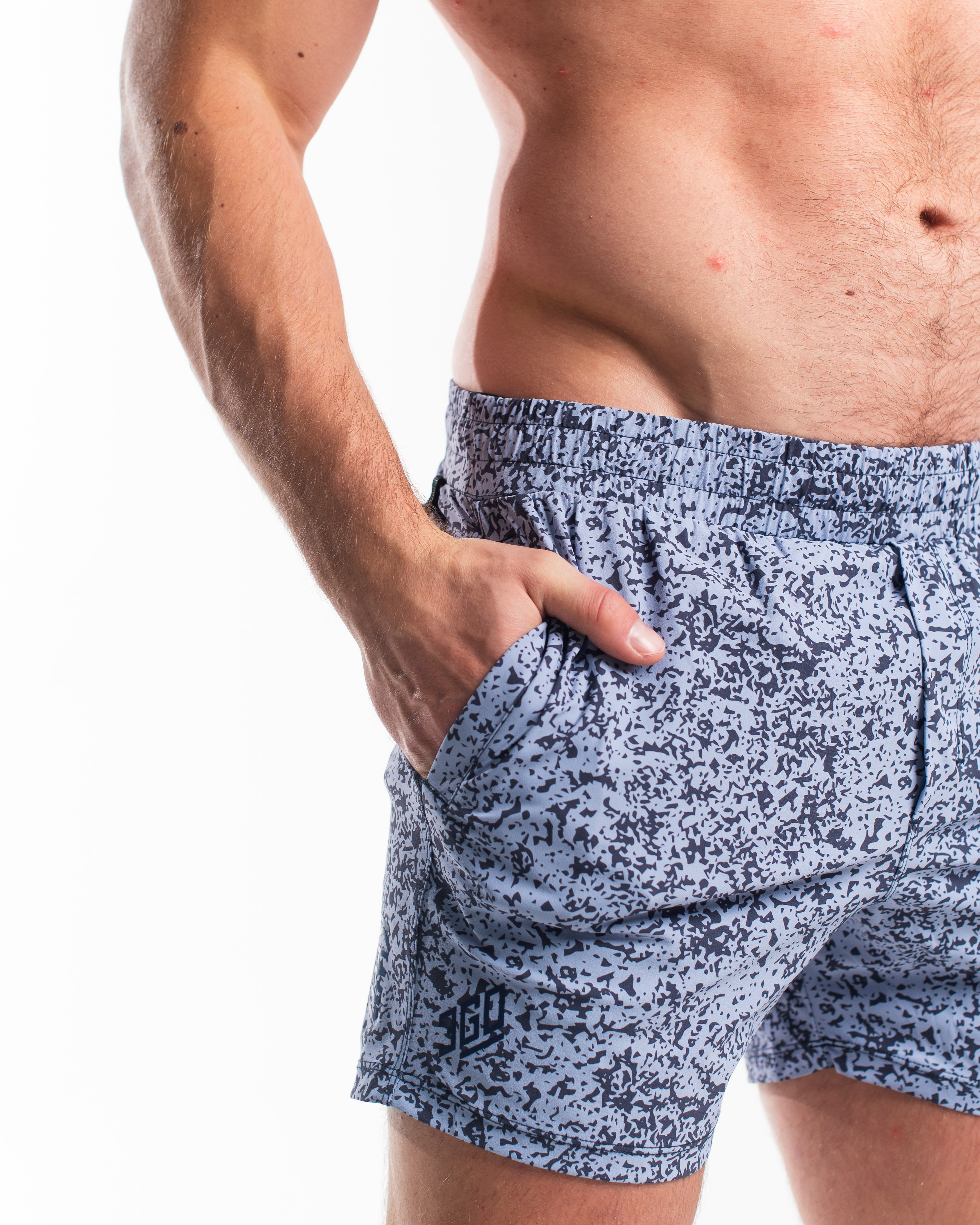 Detail of durable ripstop nylon pocket and hidden wallet compartment on Foggy Navy 360Go shorts.