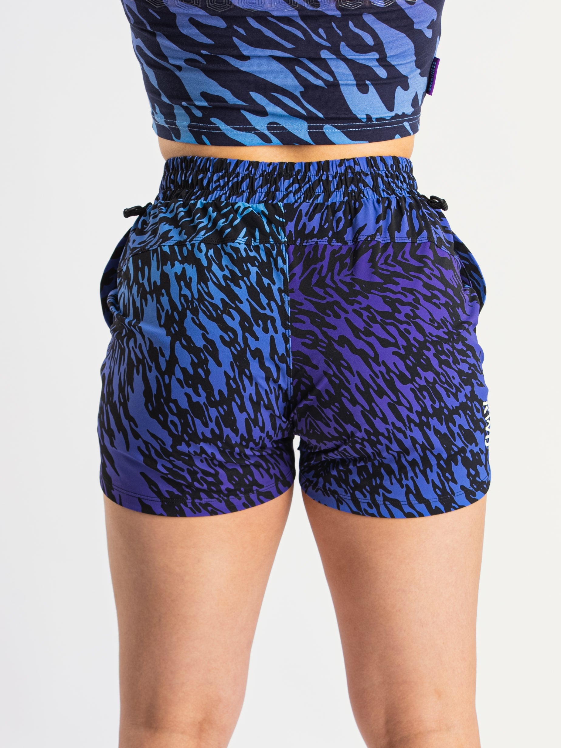 Back view of A7 360Go 1Z KWD Shorts in Violet Tiger, featuring ripstop loop-through pockets and tapered fit.