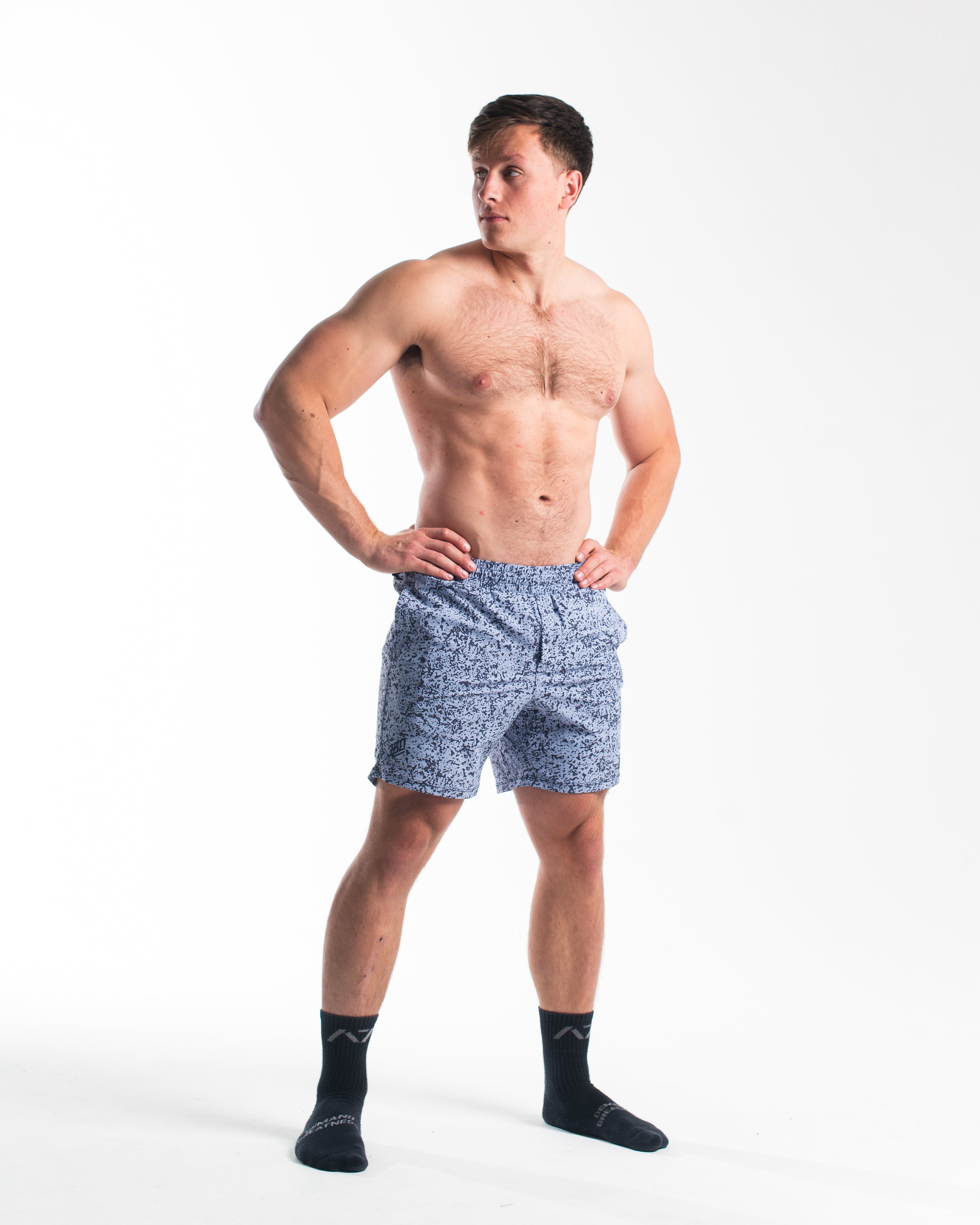 Full body image of athlete wearing A7 360Go 1Z Shorts in Foggy Navy, showcasing fit and performance design.