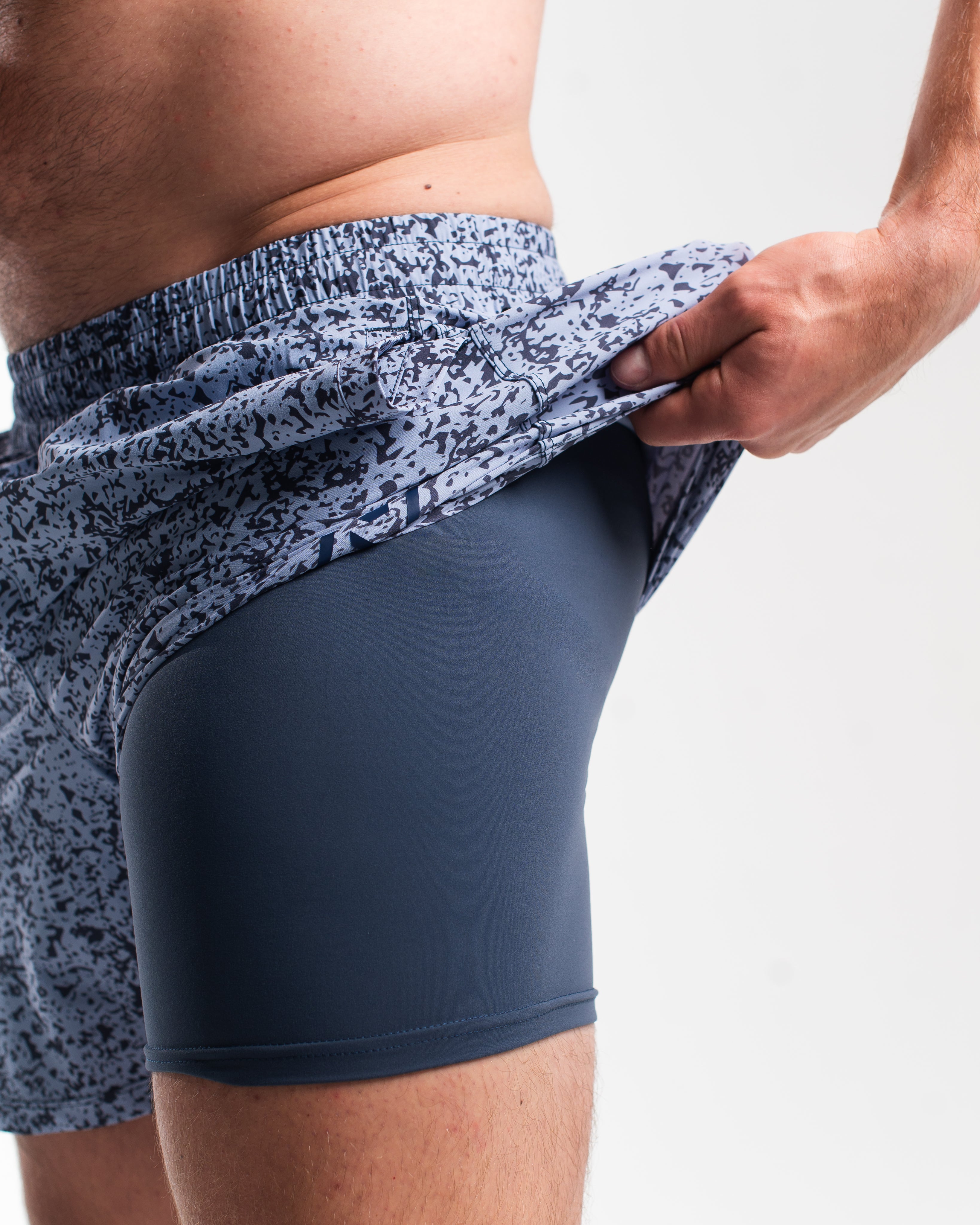 Close-up of built-in 1Z performance liner in Foggy Navy 360Go Shorts offering support and chafe-free comfort.