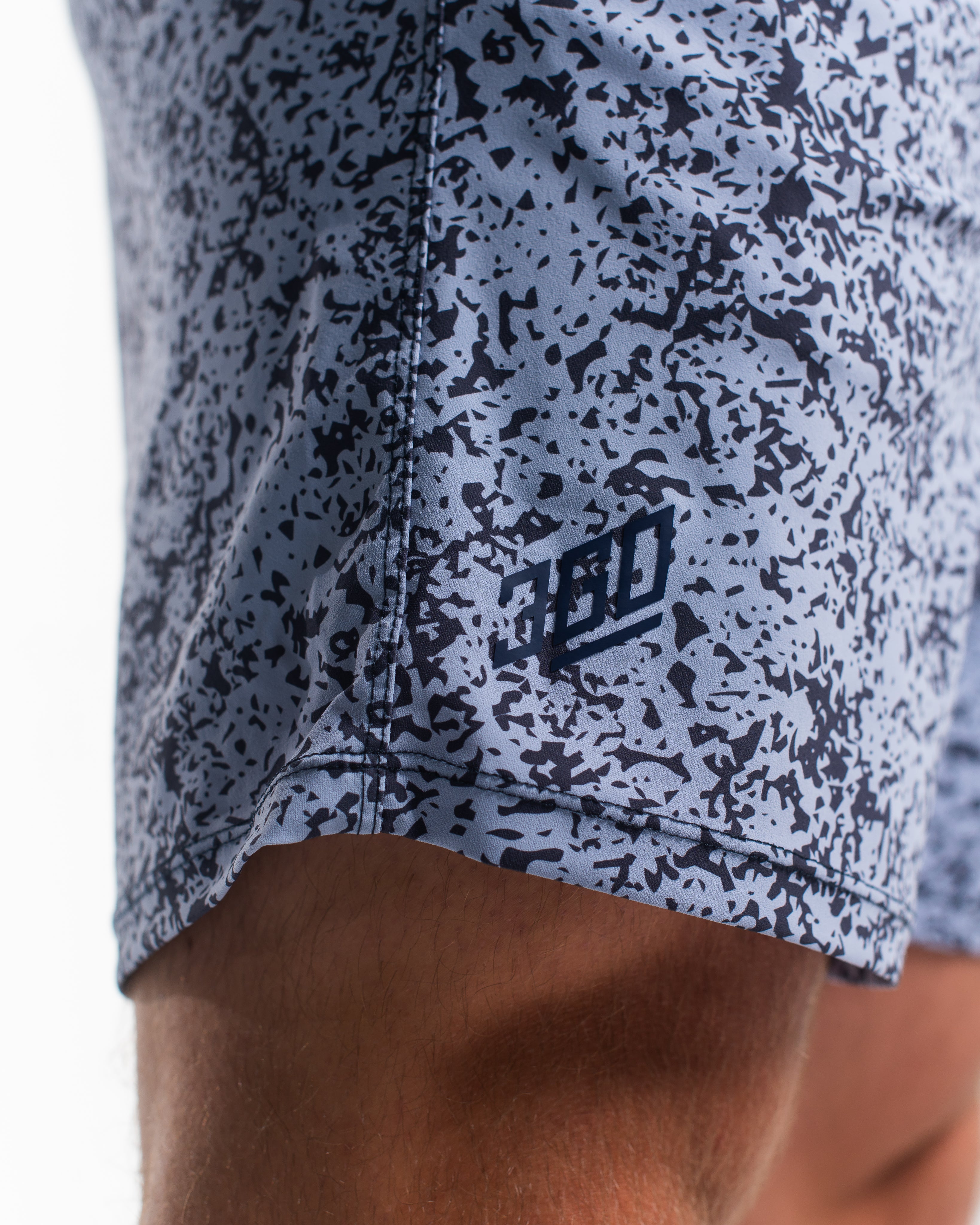Matte silicone A7 logo on 360Go 1Z Shorts in Foggy Navy offering a subtle and clean athletic look.