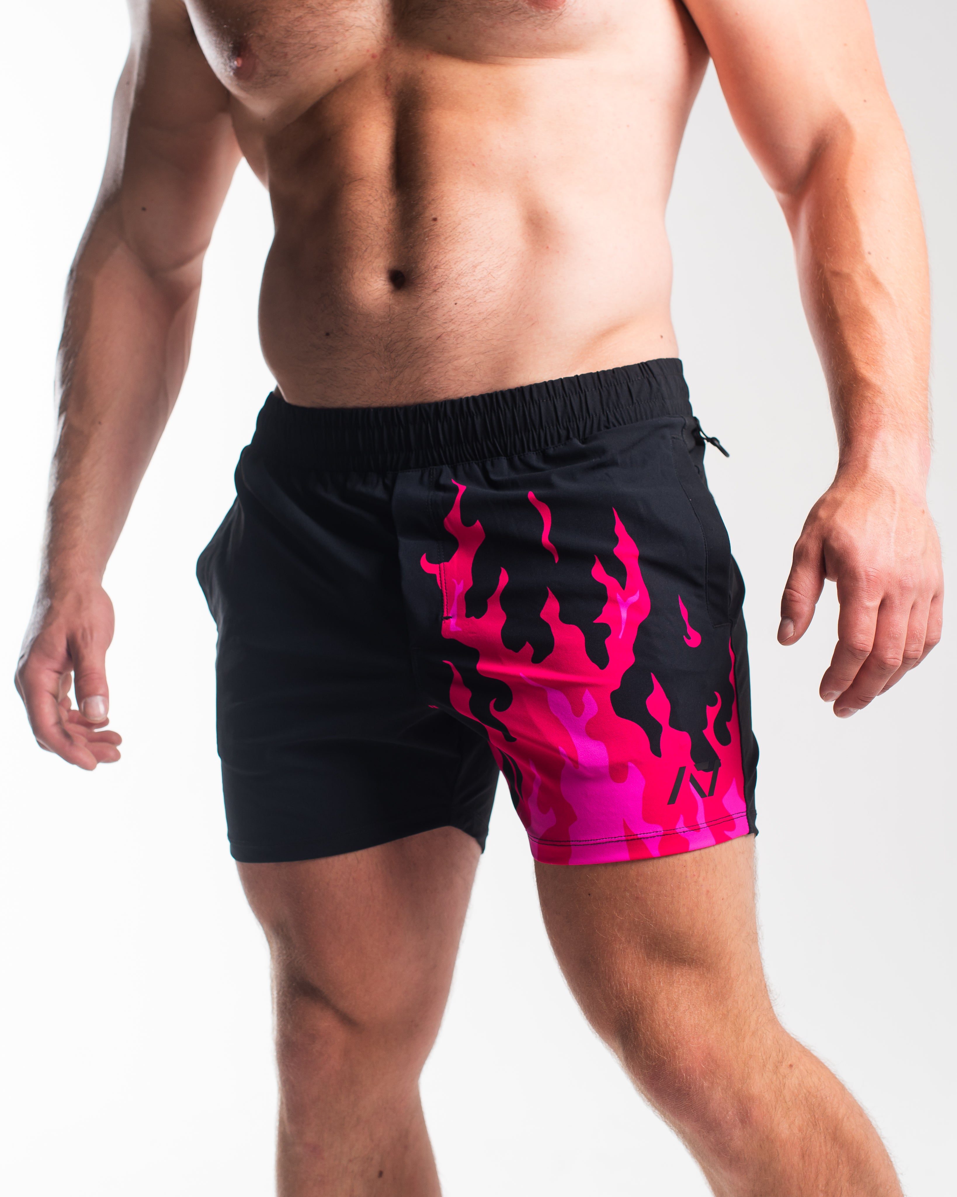Front view of A7 360Go KWD Shorts in Accelerant Pink featuring athletic cut, wide waistband, and bold pink blame design.