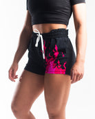 Side profile of Accelerant Pink 360Go KWD Shorts highlighting shorter inseam and flexible fit for high-mobility training.