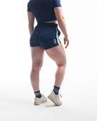 Rear view of A7 360Go KWD Shorts in Night Light with ripstop loop-through pockets and bold black-and-lime contrast.