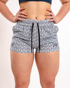 Front view of A7 360Go KWD Shorts in Stelacrosha Tides, featuring deep gray-black tones, wide waistband, and performance fit.