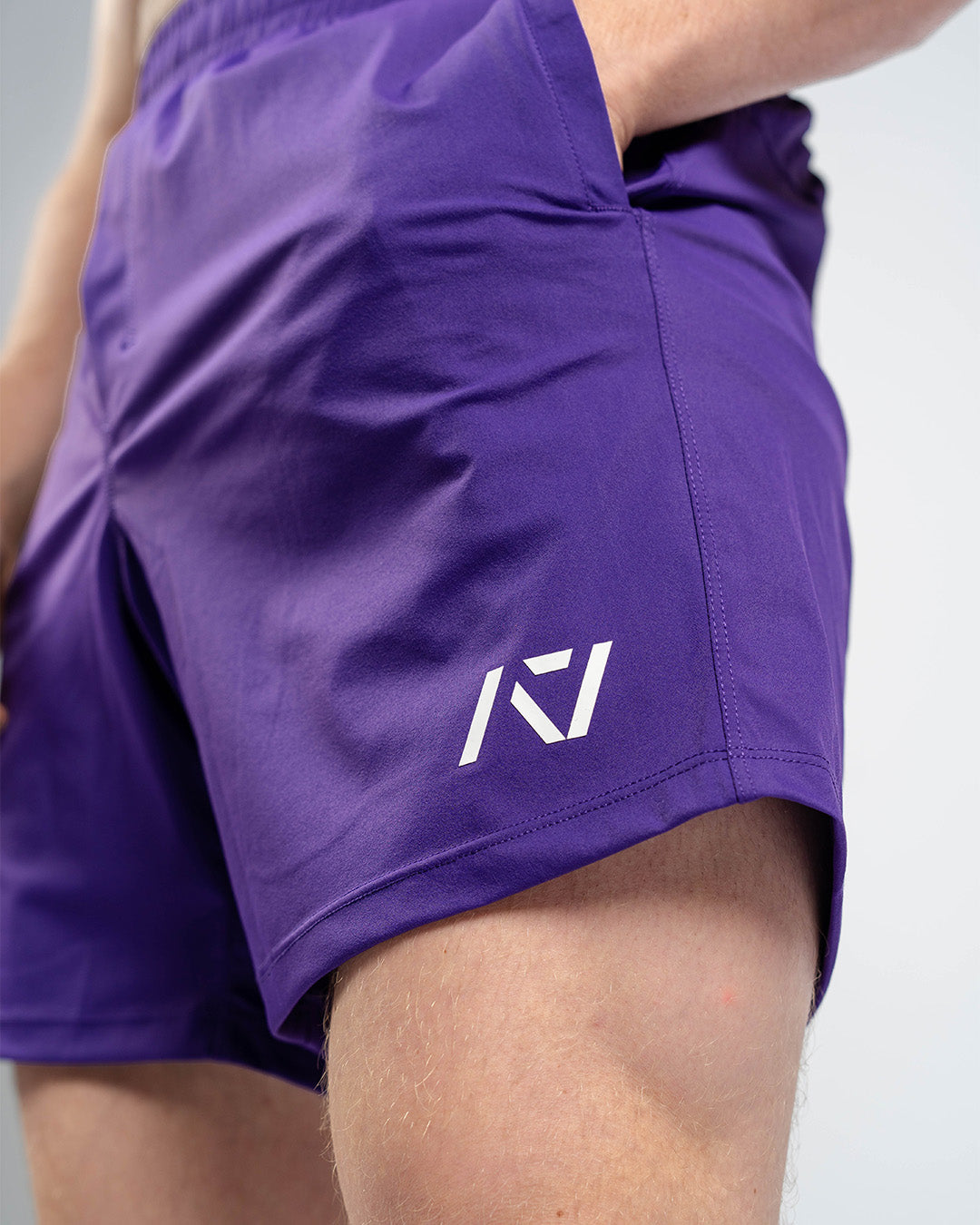 Matte silicone A7 logos on Purple 360Go Shorts offering subtle branding on a bold color base.