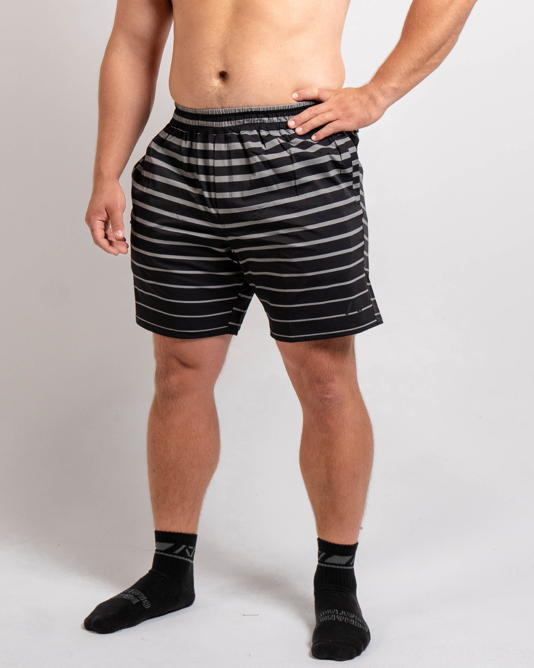 Front view of A7 360Go Shorts in Shadow black, Regular inseam, with wide waistband and minimalist athletic fit.