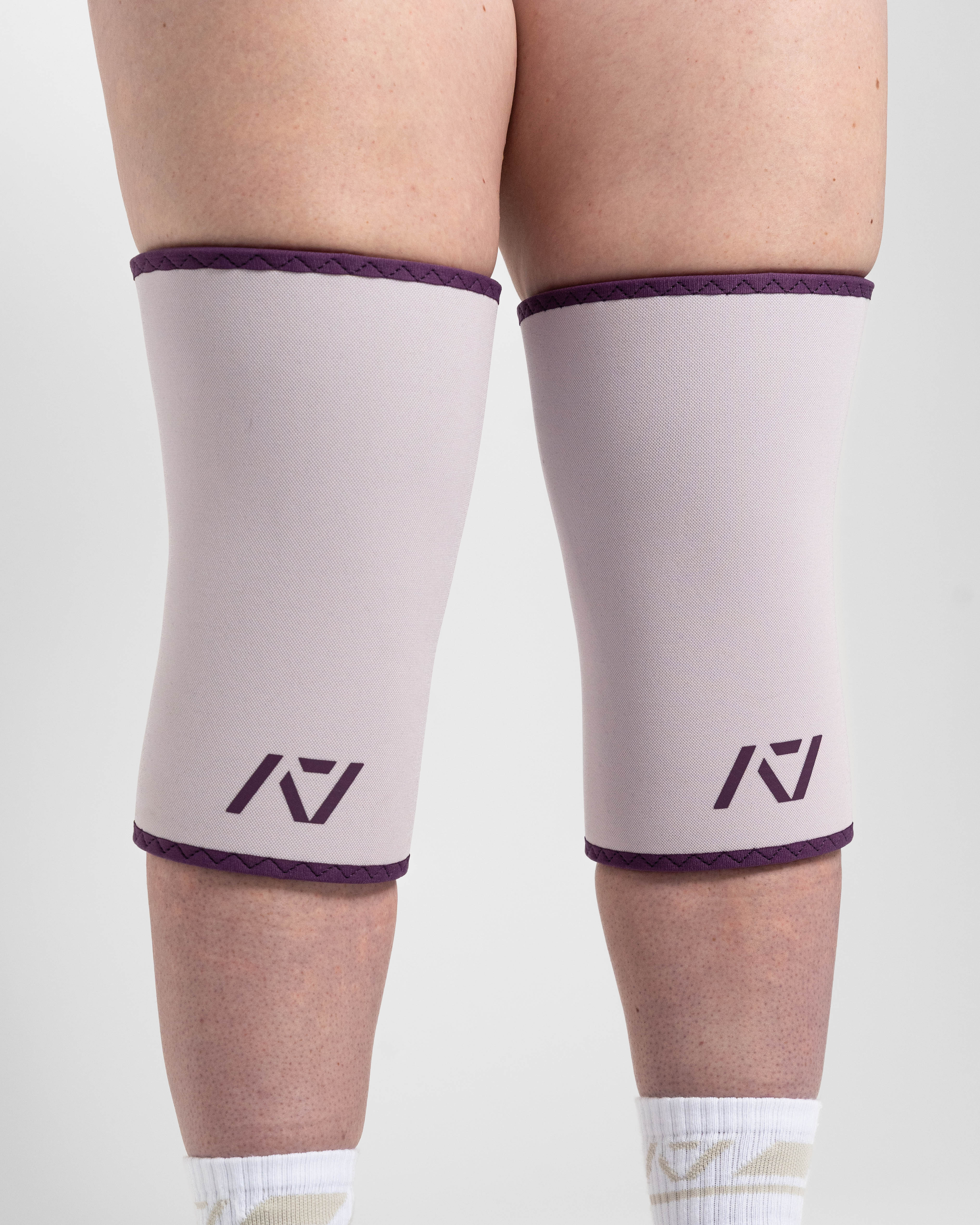 Close up of hourglass knee sleeves in Lavender on female