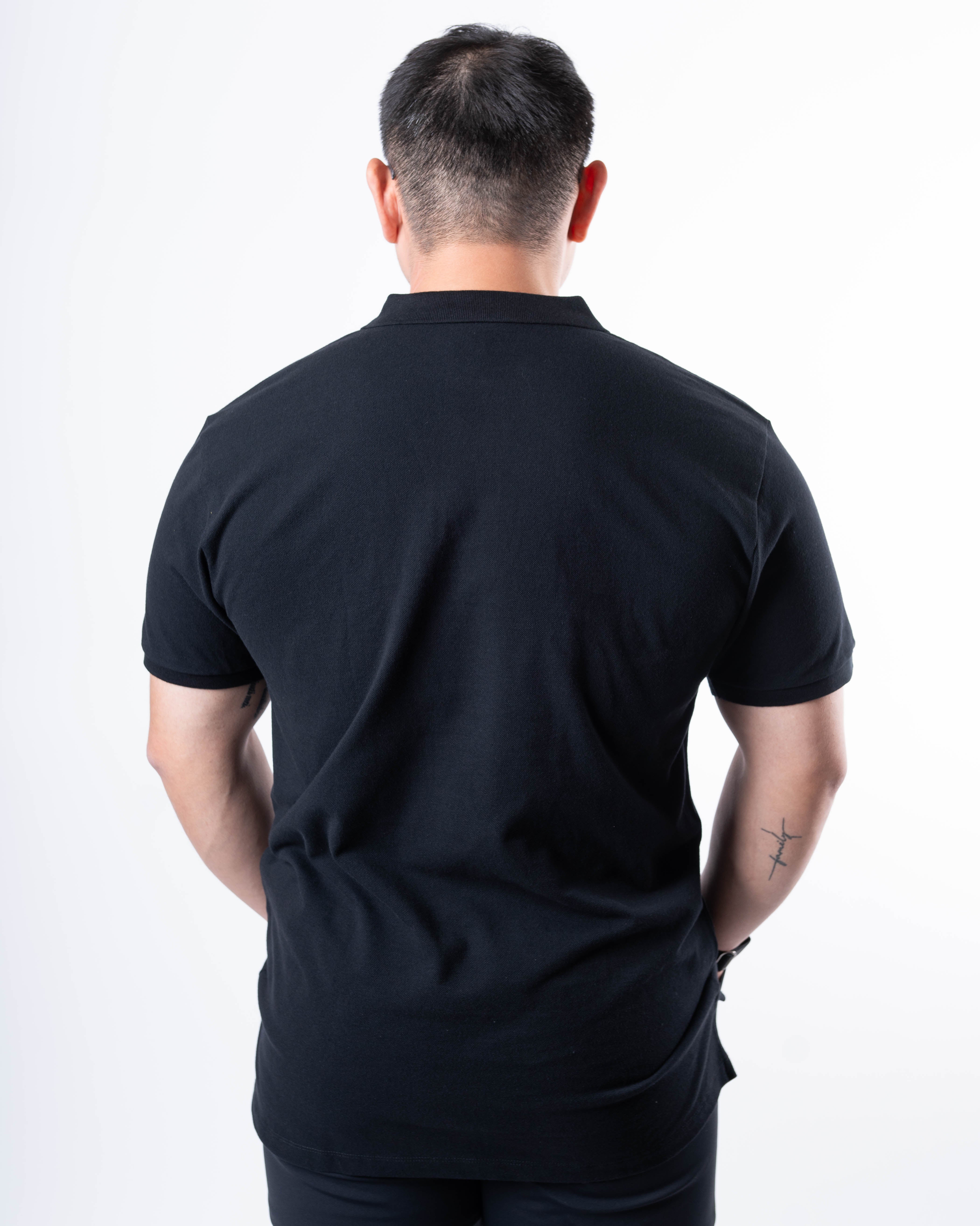 Back view of A7 Cotton Polo in Black, highlighting the tennis tail design.