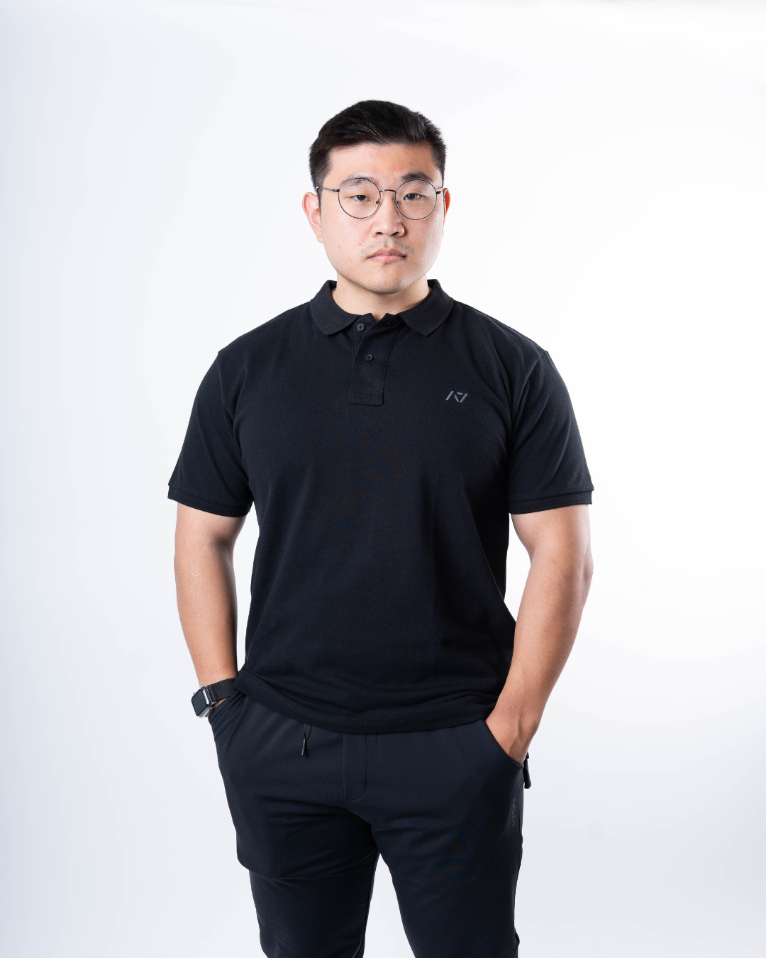 Front view of A7 Cotton Polo in Black, showcasing athletic fit and rib-knit collar.
