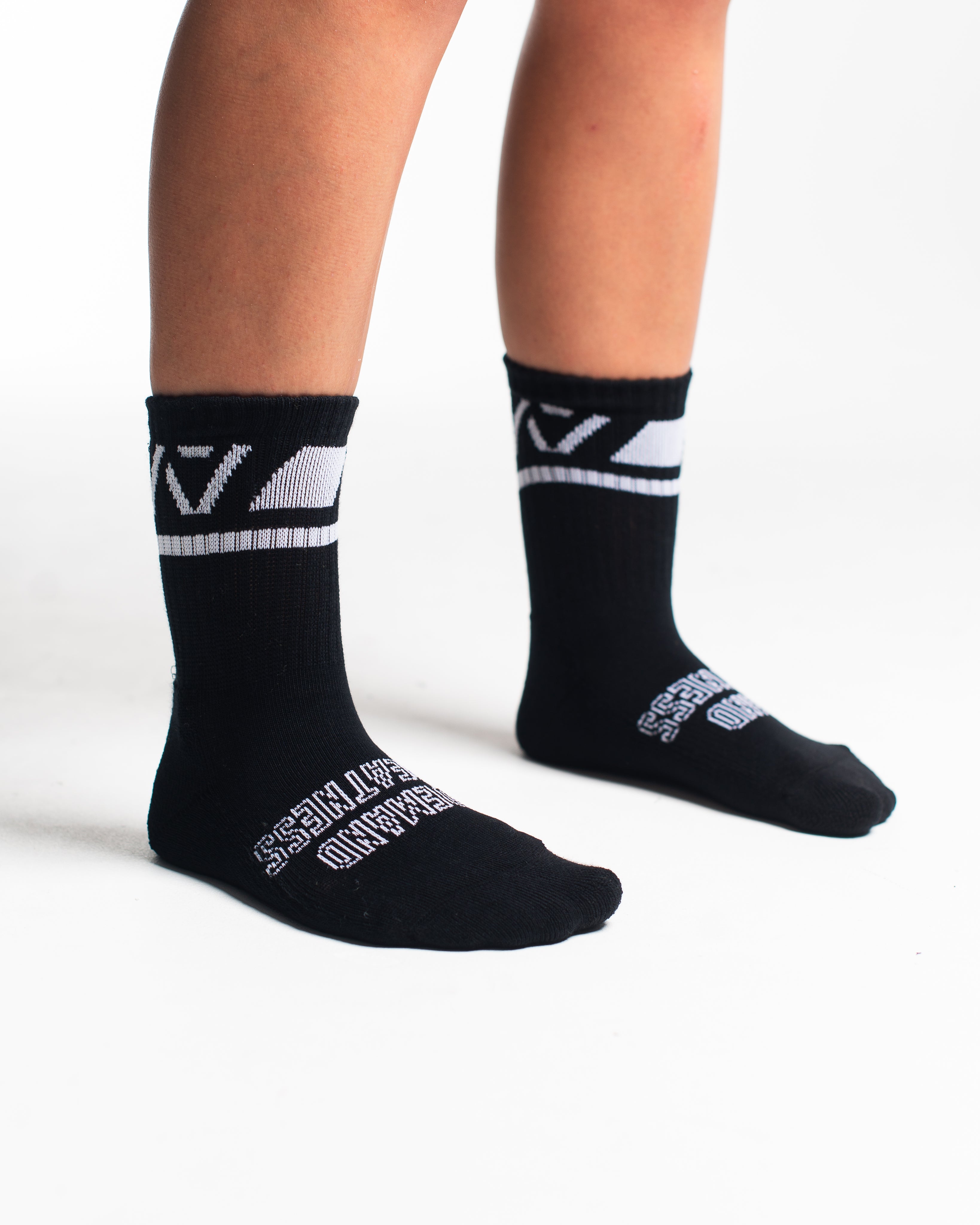 Side profile of A7 Crew Socks in Black Domino, highlighting the A7 logo on the ankle and compression-style top.