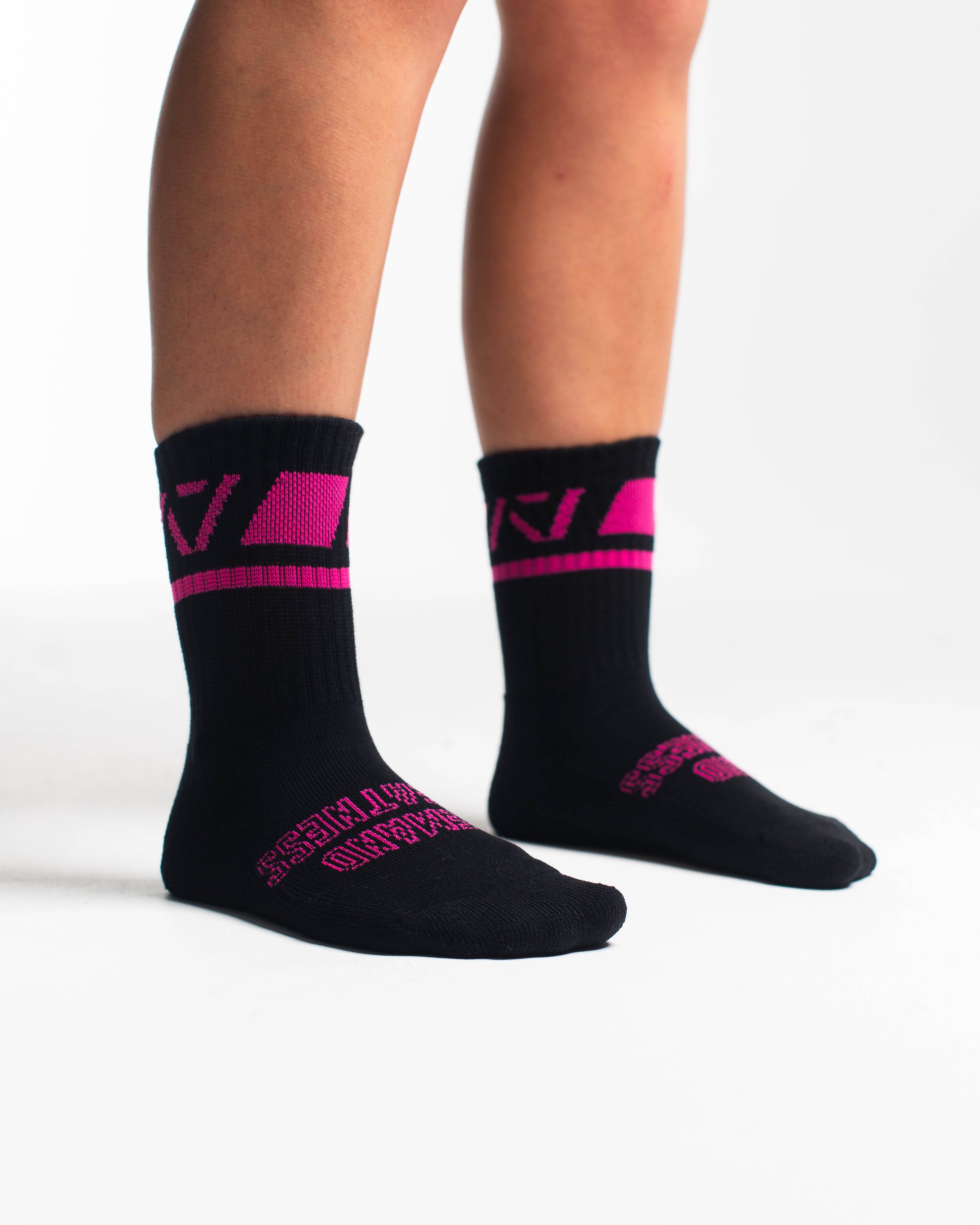 Side profile of A7 Crew Socks in Flamingo, highlighting the A7 logo on the ankle and compression-style top.