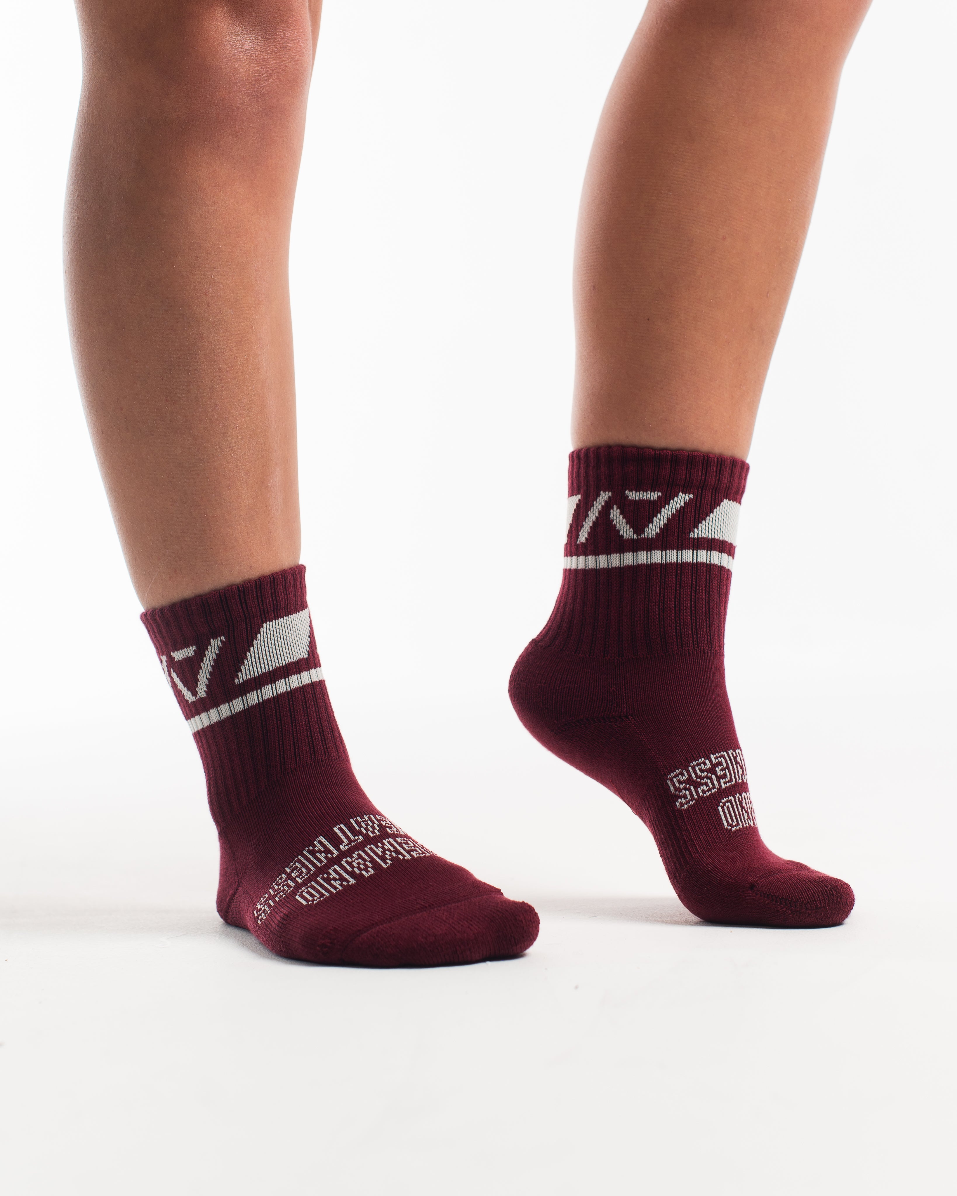 Side profile of A7 Crew Socks in Ivory Rose, highlighting the A7 logo on the ankle and compression-style top.