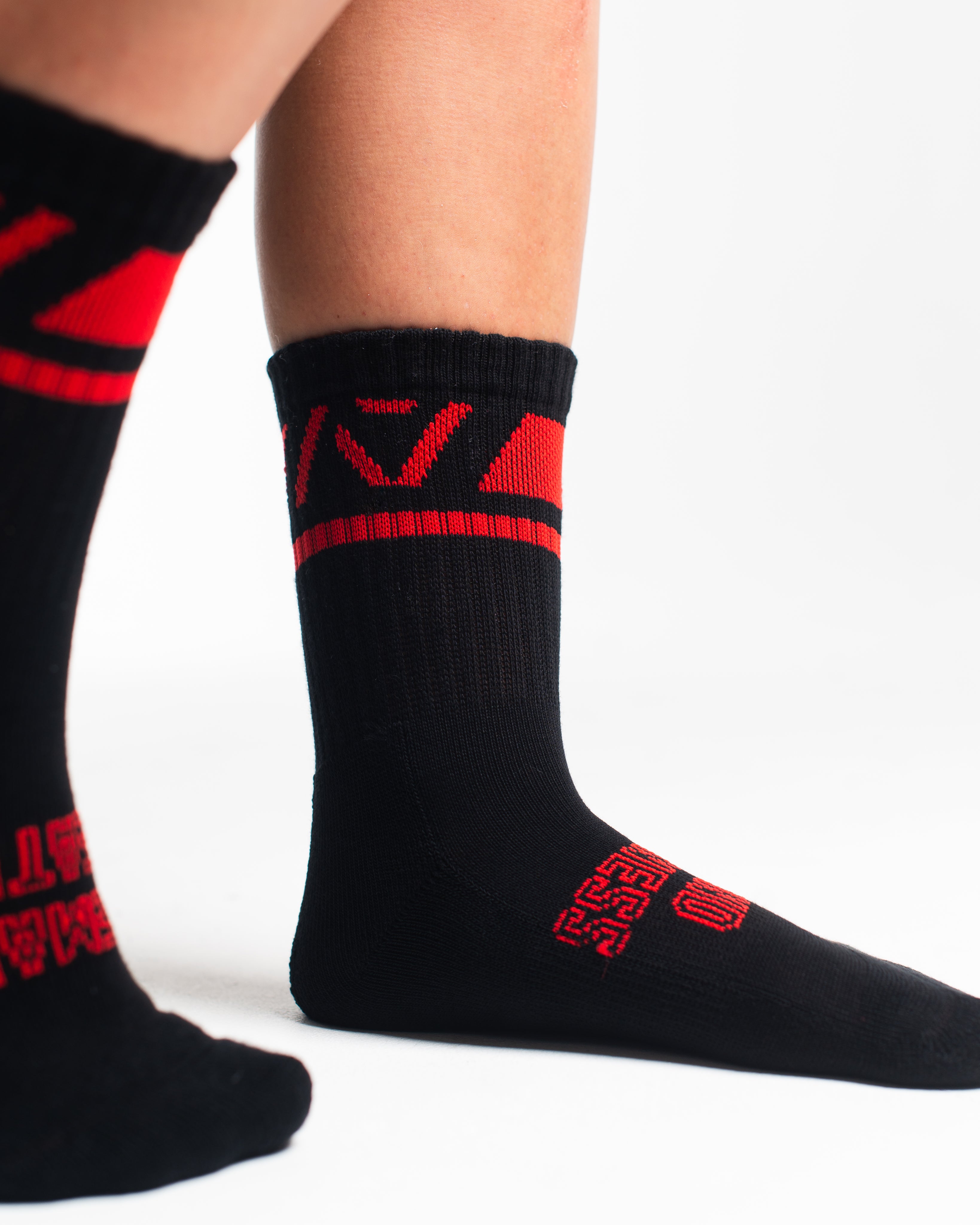 Close-up of the knit fabric on A7 Crew Socks in Red Dawn, showing texture and stitching details.